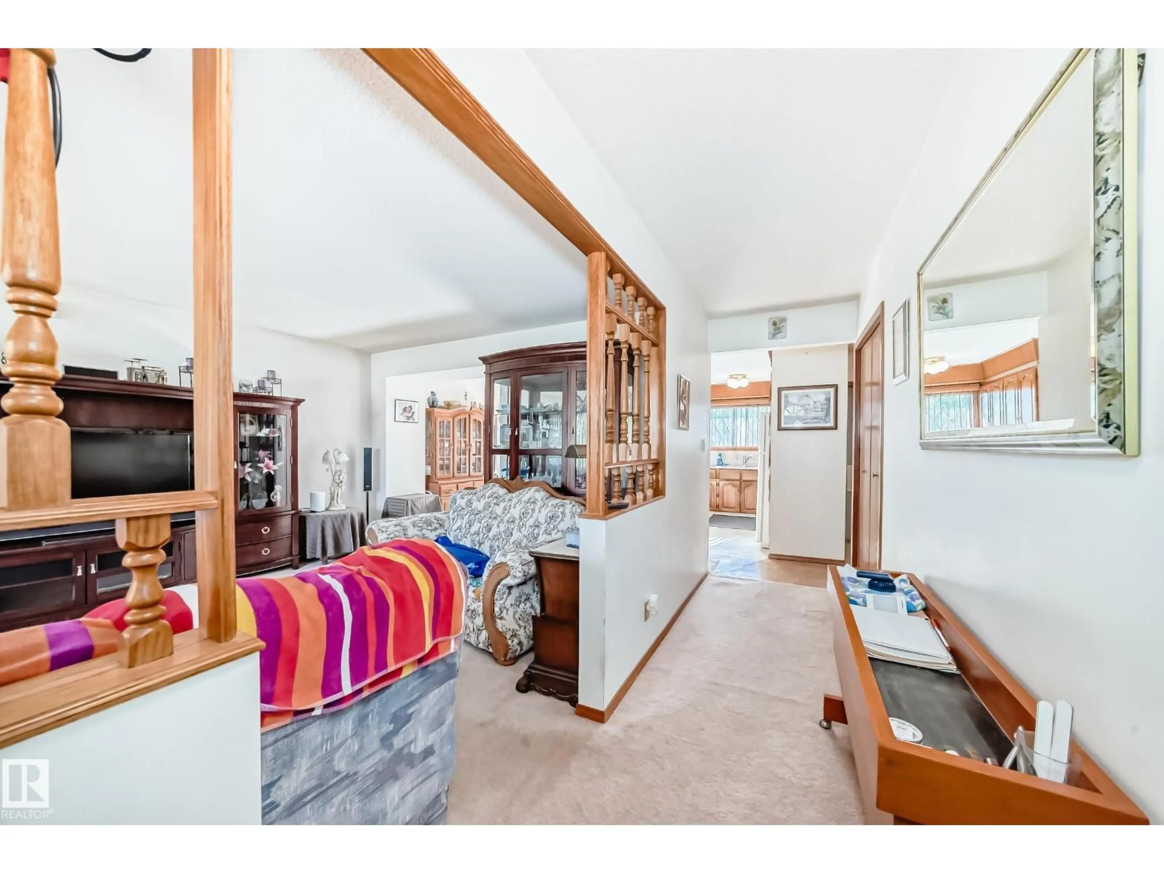 Living room with furniture, wood/laminate floor for 7007 140 AV, Edmonton Alberta T5G2M6