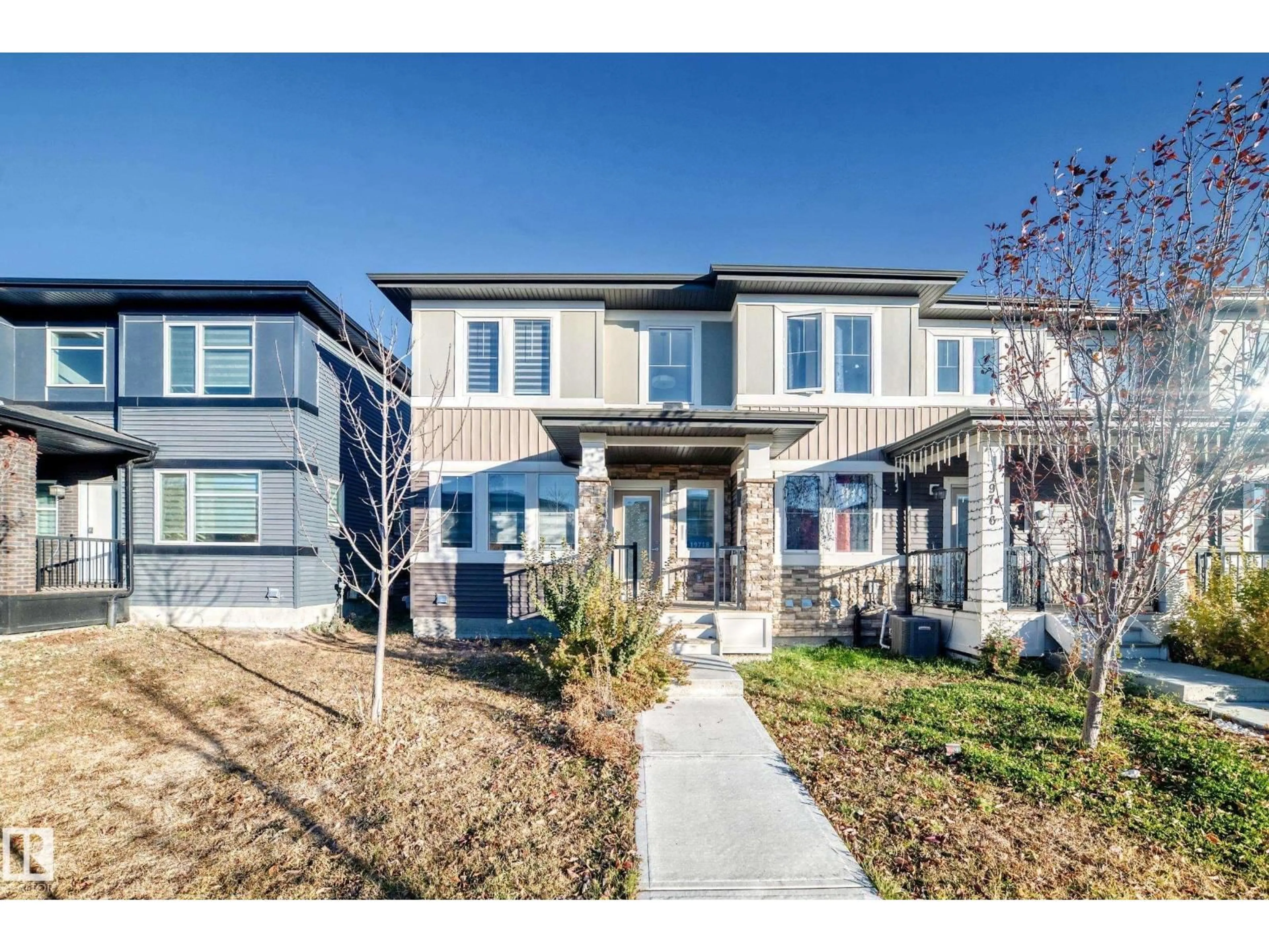 Home with brick exterior material, street for 19718 27 AV, Edmonton Alberta T6M0X1