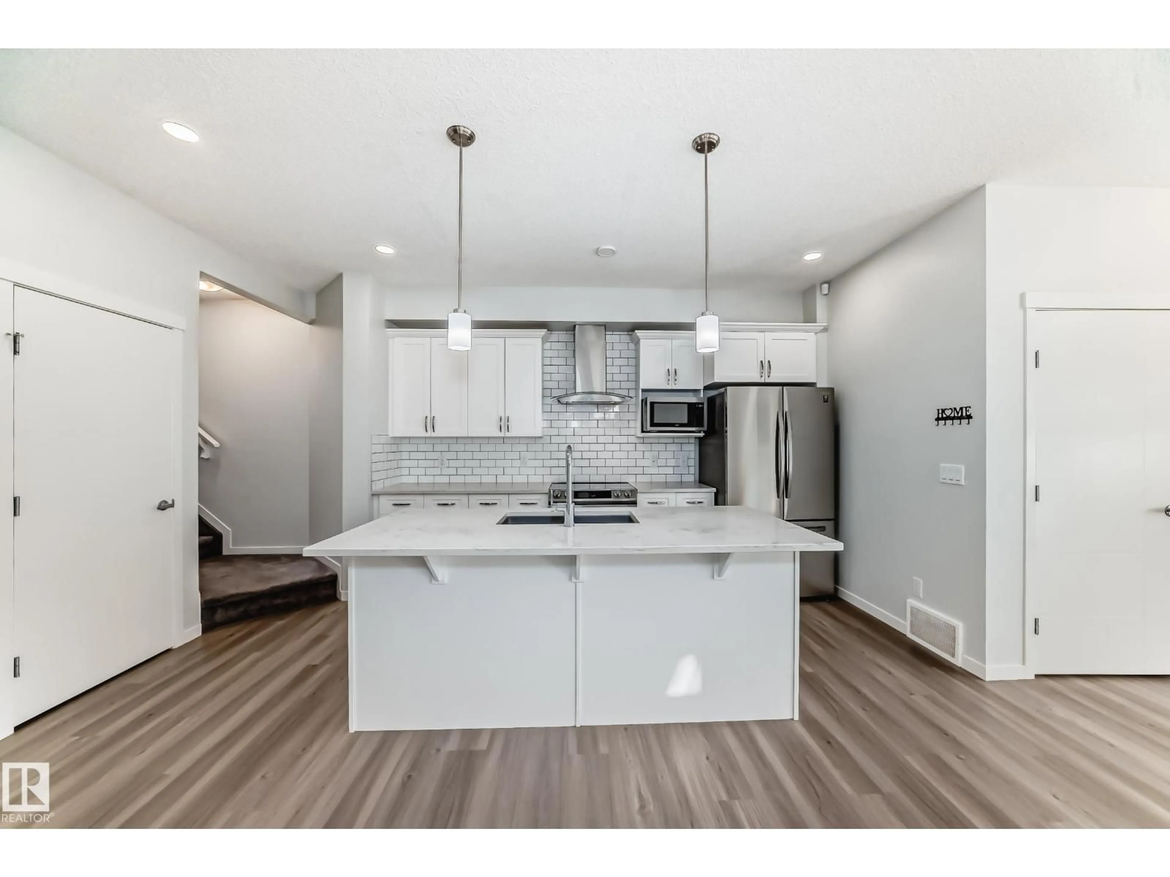 Open concept kitchen, unknown for 19718 27 AV, Edmonton Alberta T6M0X1