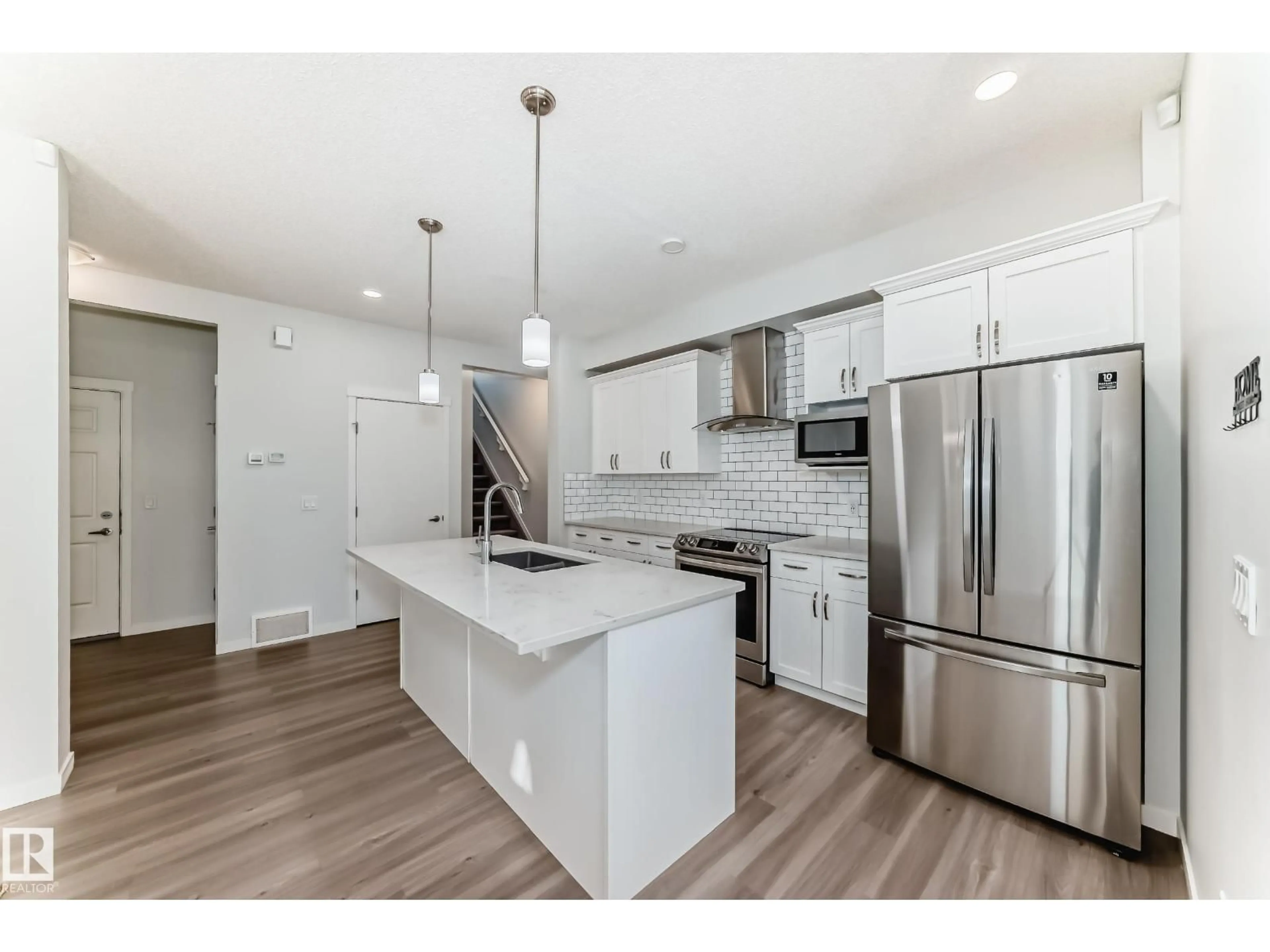 Open concept kitchen, unknown for 19718 27 AV, Edmonton Alberta T6M0X1