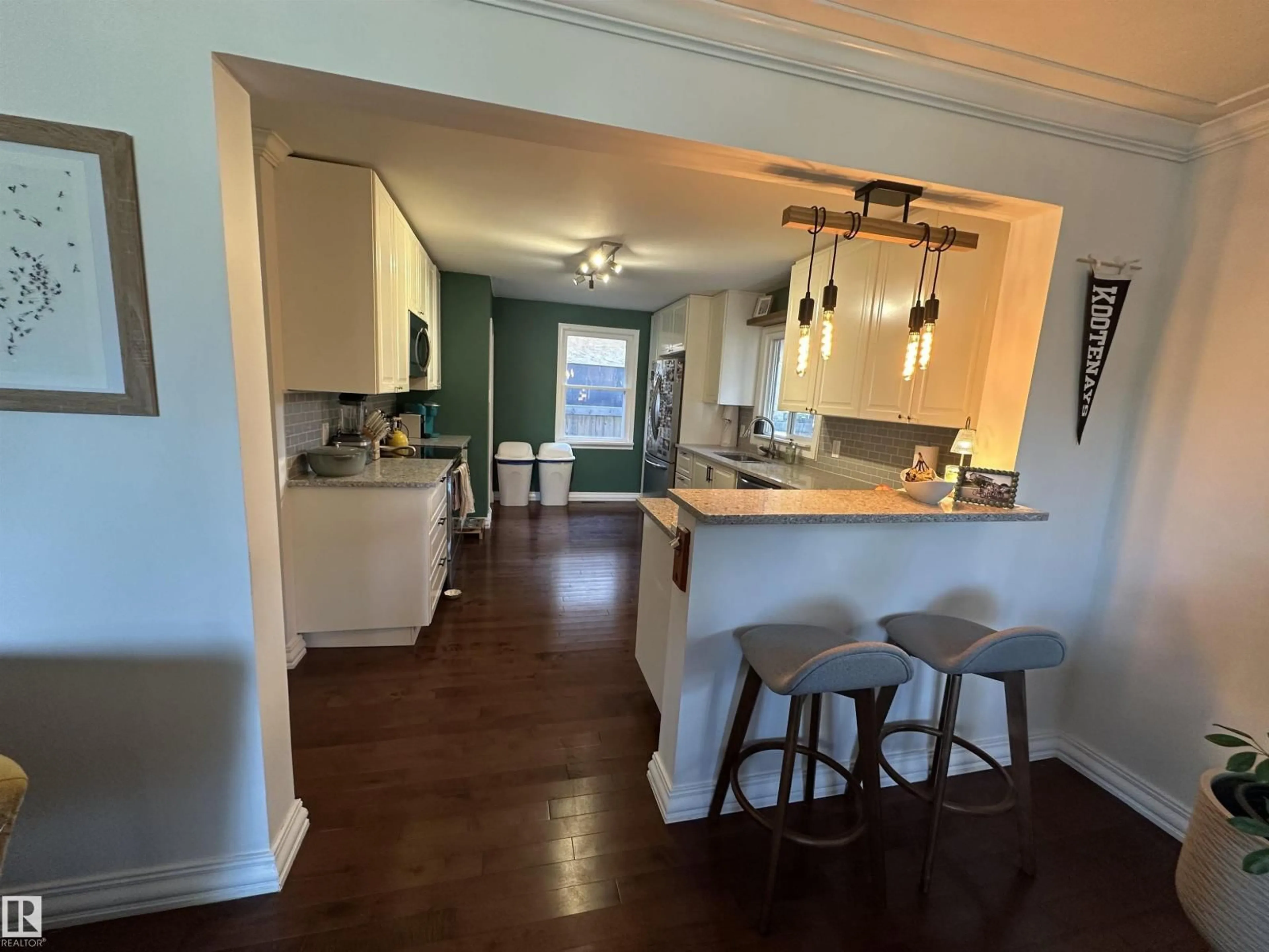 Open concept kitchen, wood/laminate floor for 10447 81 ST, Edmonton Alberta T6A3K9