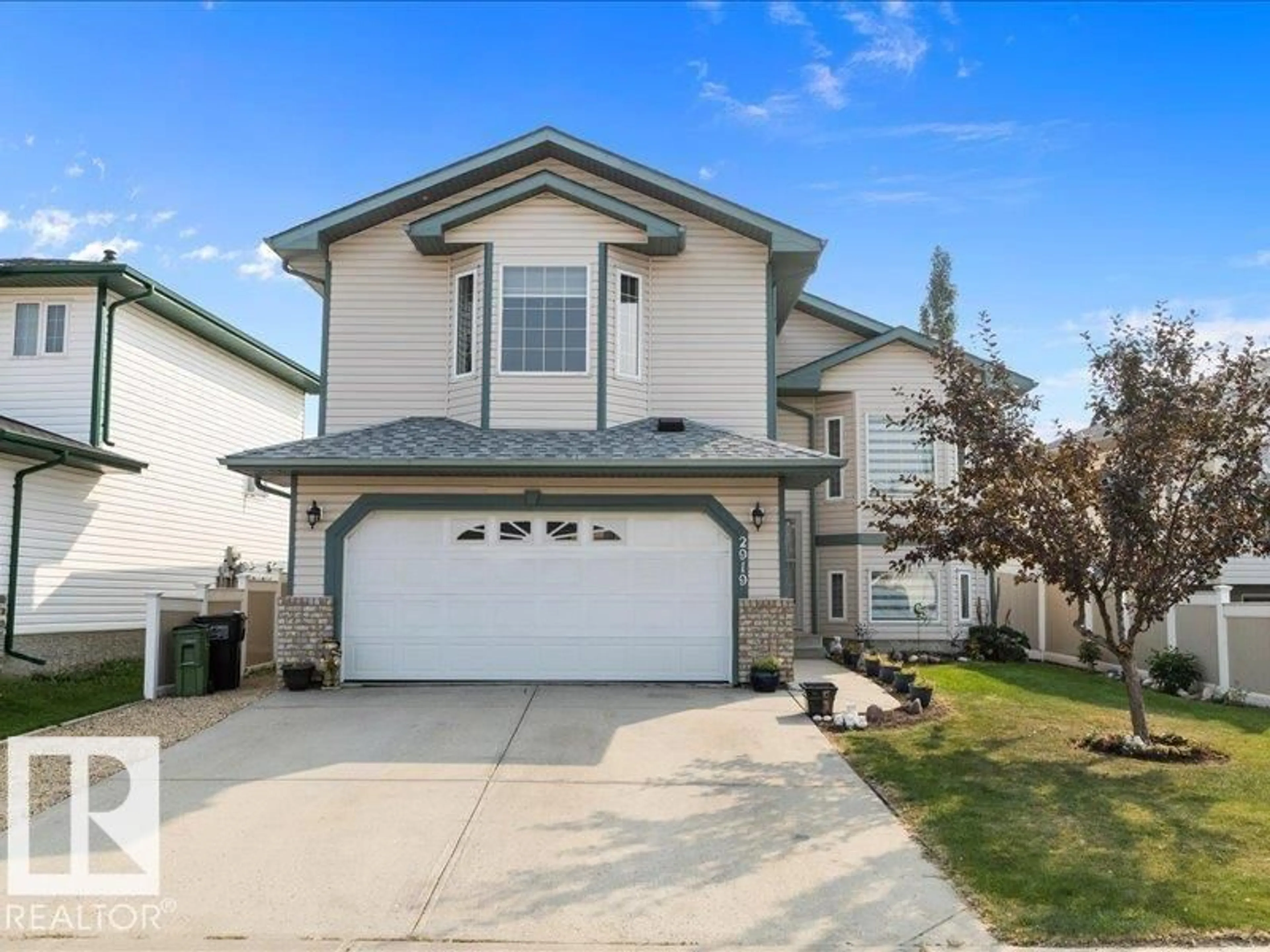 Home with vinyl exterior material, street for NW - 2919 151A AV, Edmonton Alberta T5Y2Y5