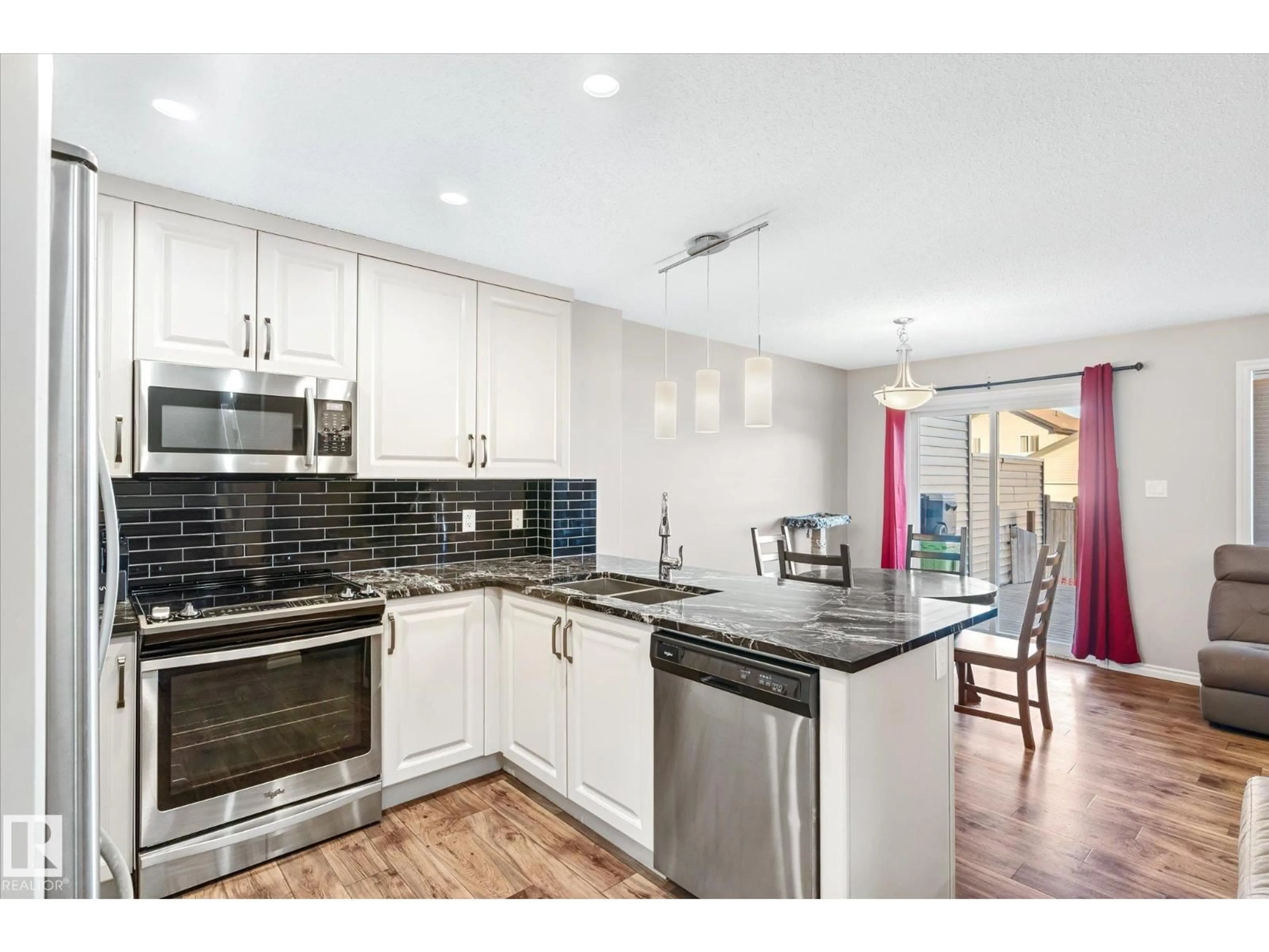 Open concept kitchen, unknown for 2424 19A AV, Edmonton Alberta T6T2C9