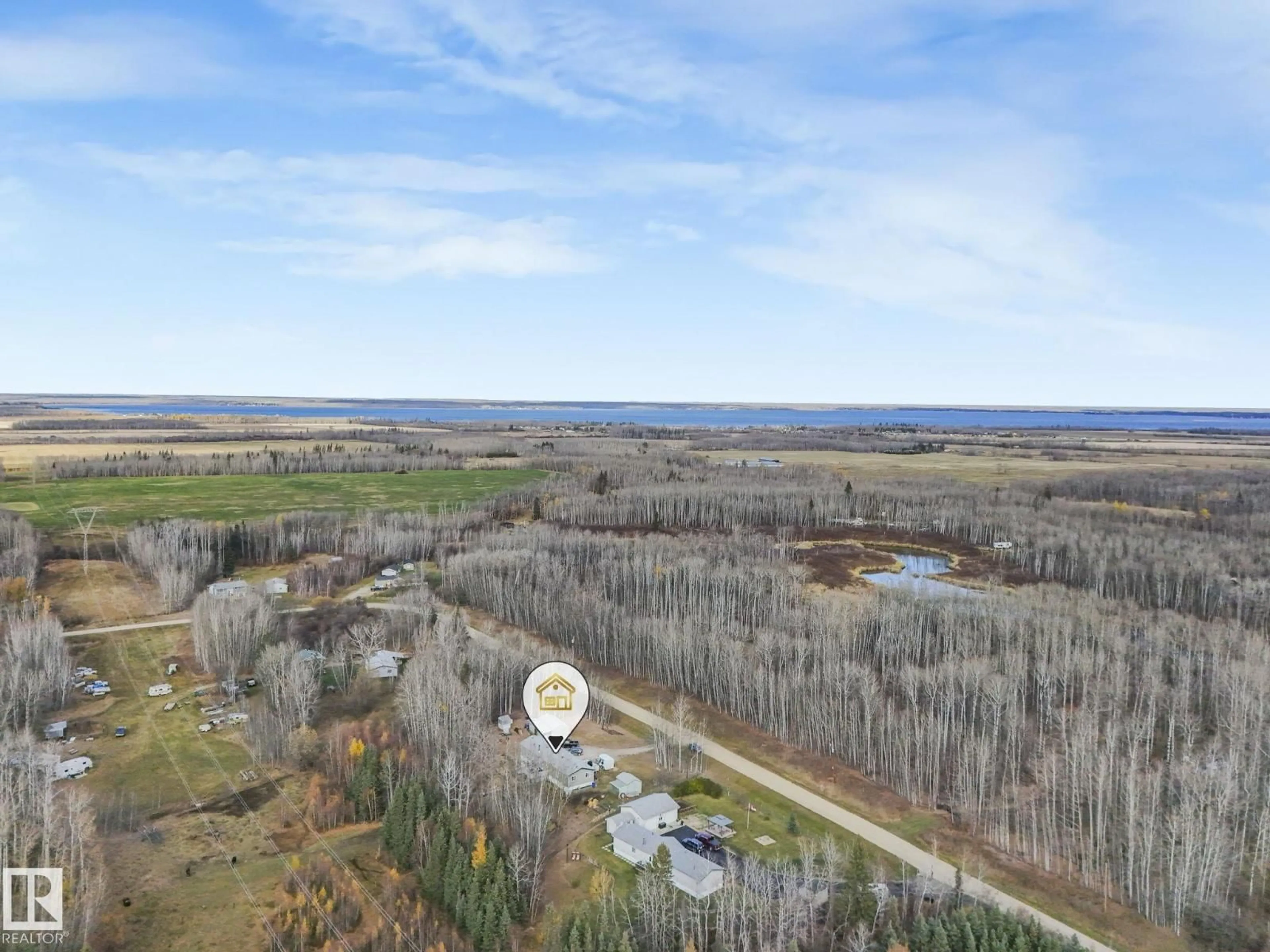 A pic from outside/outdoor area/front of a property/back of a property/a pic from drone, water/lake/river/ocean view for #13 - 54227 RGE ROAD 41, Rural Lac Ste. Anne County Alberta T0E0E1