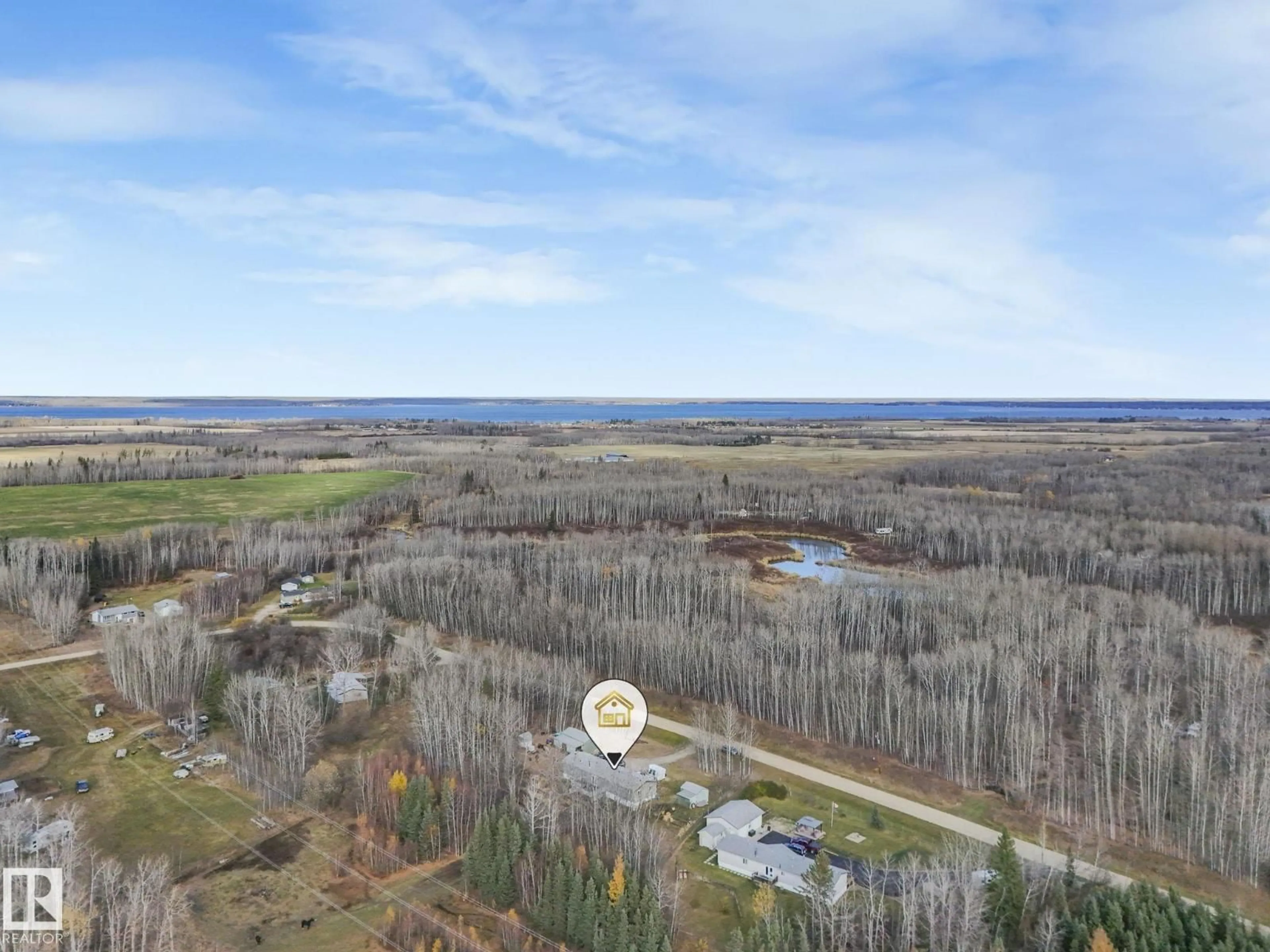 A pic from outside/outdoor area/front of a property/back of a property/a pic from drone, water/lake/river/ocean view for #13 - 54227 RGE ROAD 41, Rural Lac Ste. Anne County Alberta T0E0E1