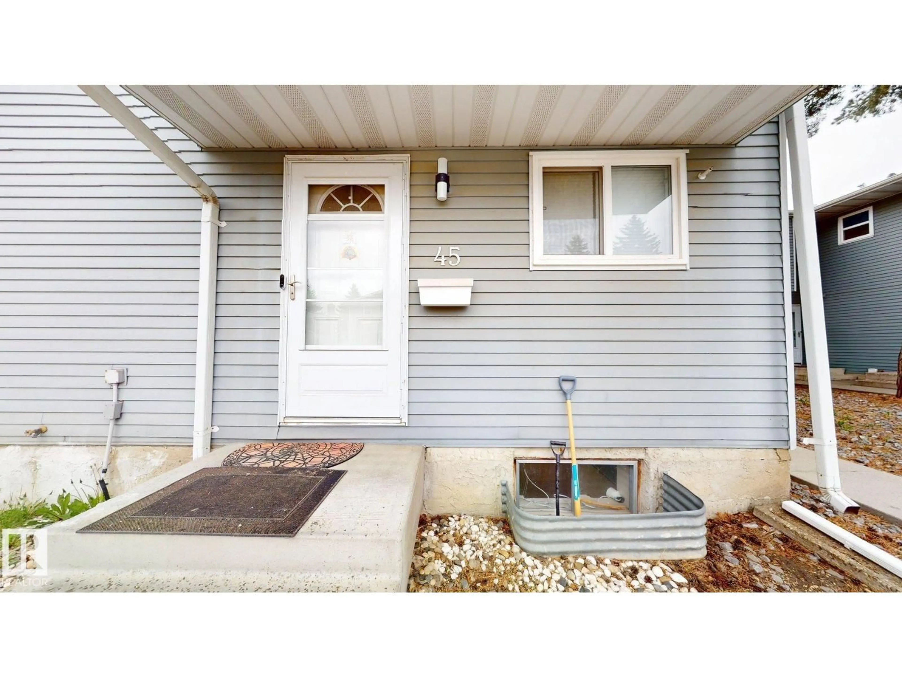 Home with vinyl exterior material, street for 45 - 4403 RIVERBEND RD, Edmonton Alberta T6H5S9