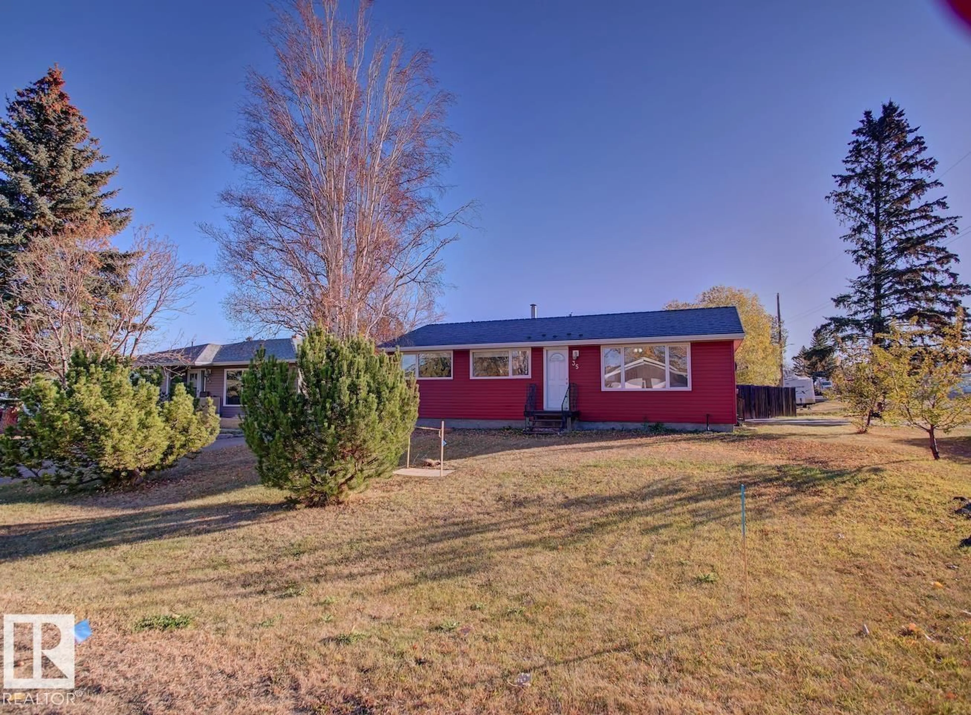 A pic from outside/outdoor area/front of a property/back of a property/a pic from drone, street for 54569 - 35 RR 215, Josephburg Alberta T8L4B9