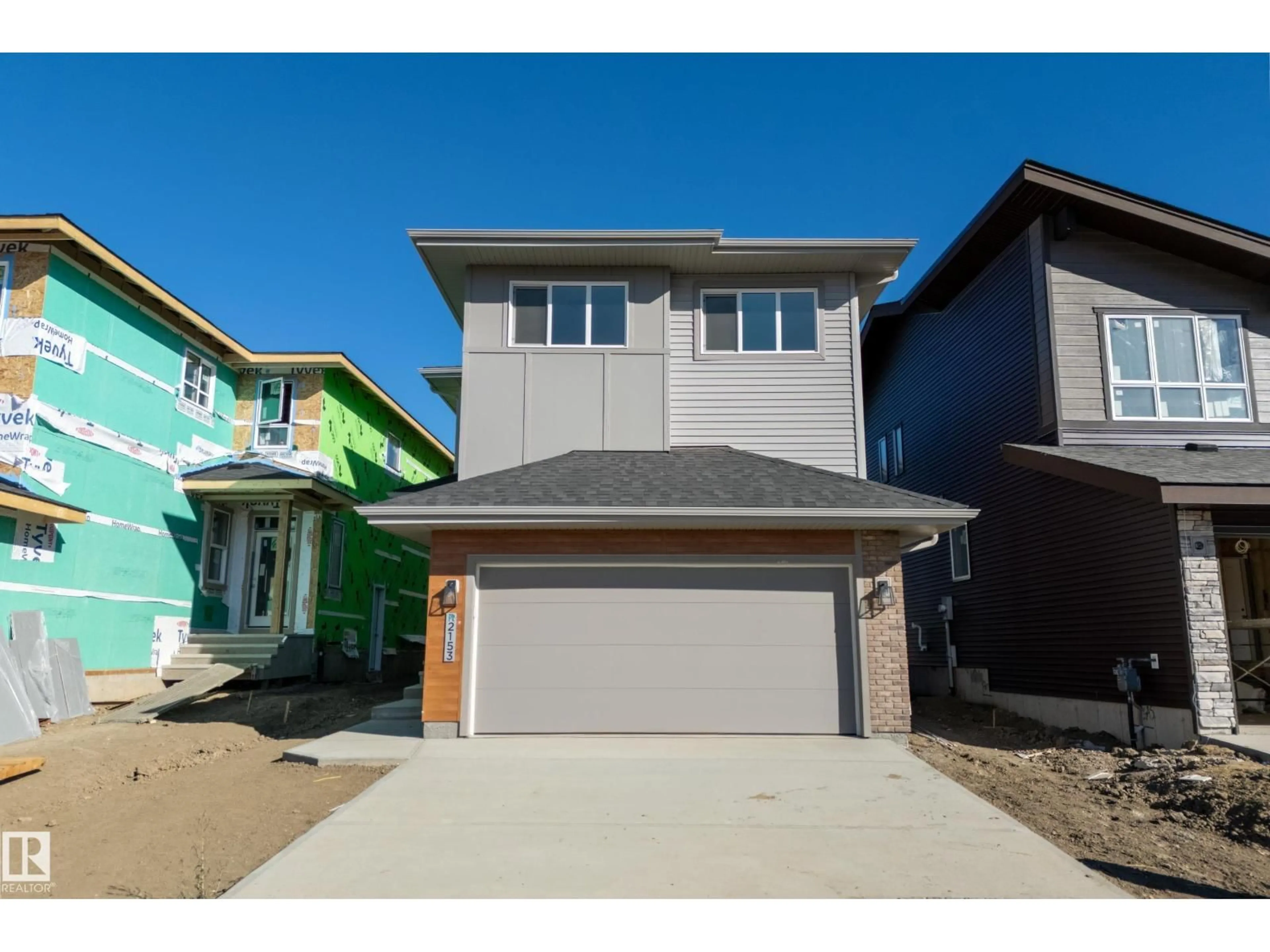 Home with vinyl exterior material, street for NW - 2153 194A ST, Edmonton Alberta T6M3J3