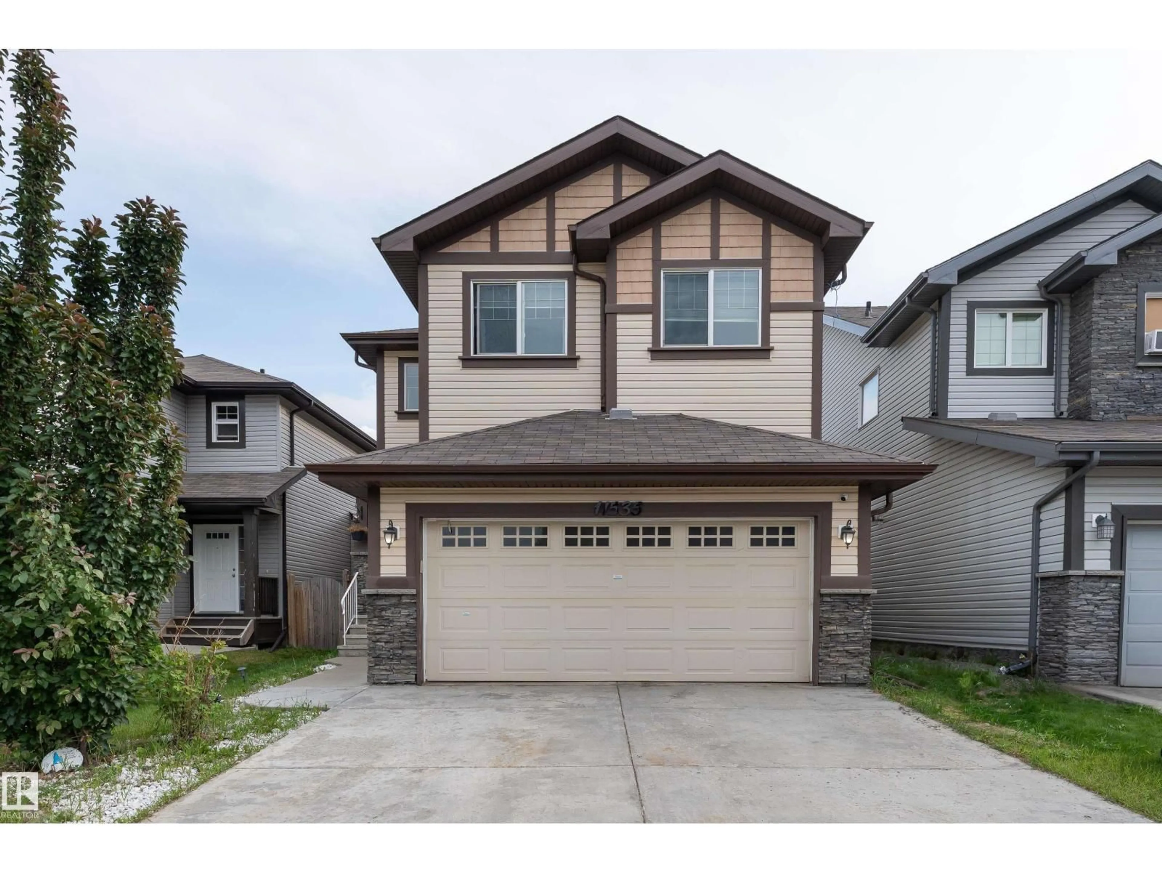 Home with vinyl exterior material, street for 11535 16 AV, Edmonton Alberta T6W0Z9