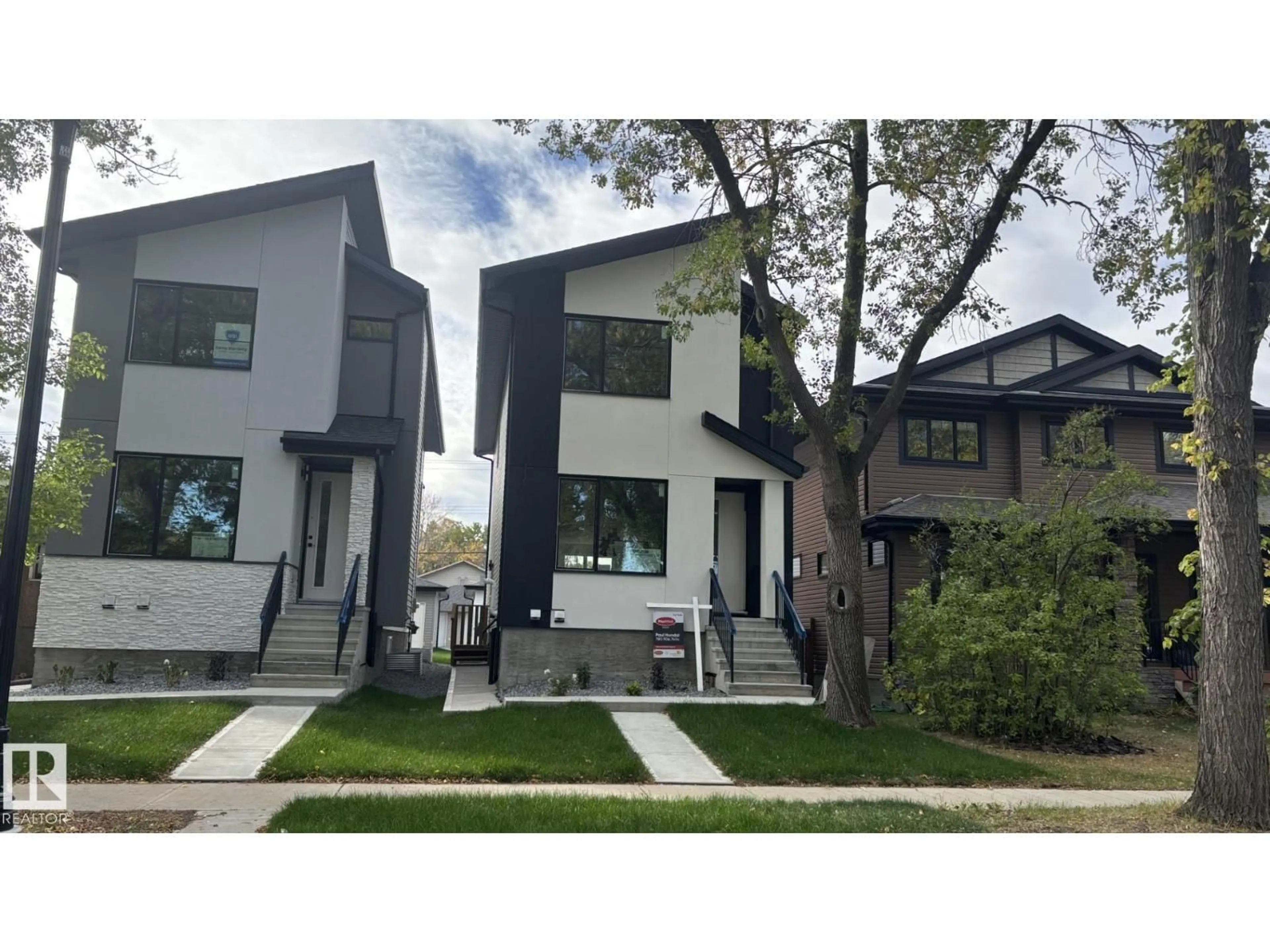 Home with vinyl exterior material, street for 11140 126 ST E NW, Edmonton Alberta T5M0P9