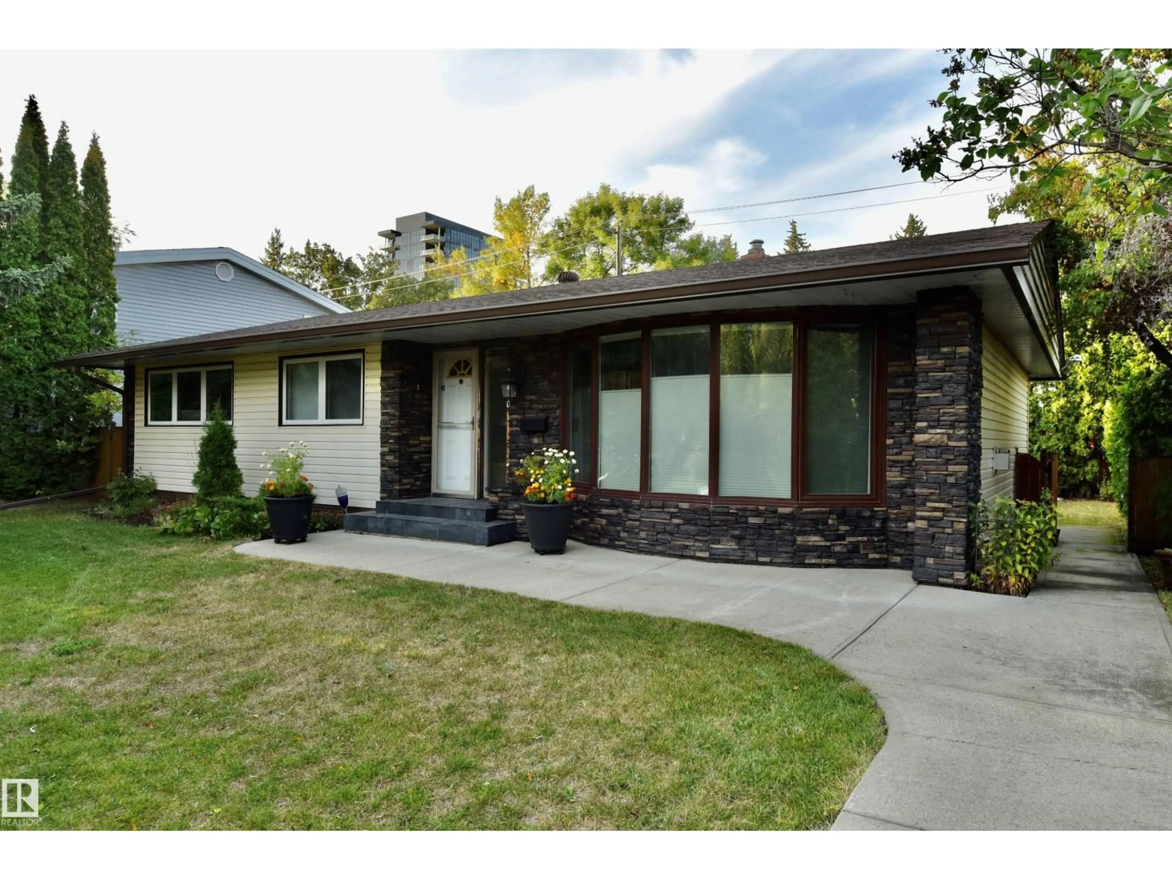 Home with brick exterior material, street for NW - 13910 101A AV, Edmonton Alberta T5N0L2
