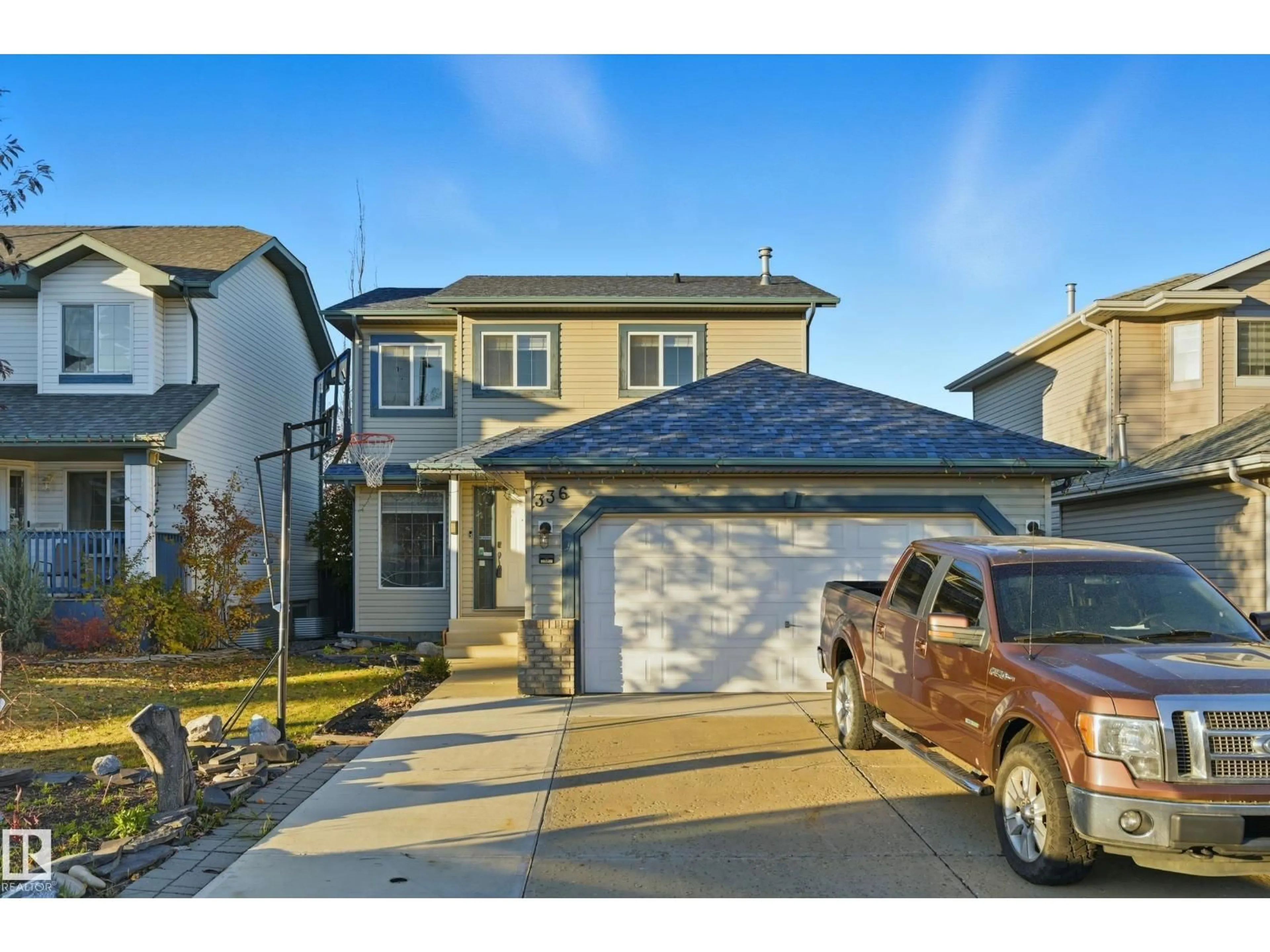 Home with vinyl exterior material, street for NW - 336 WILD ROSE WY, Edmonton Alberta T6T1P3