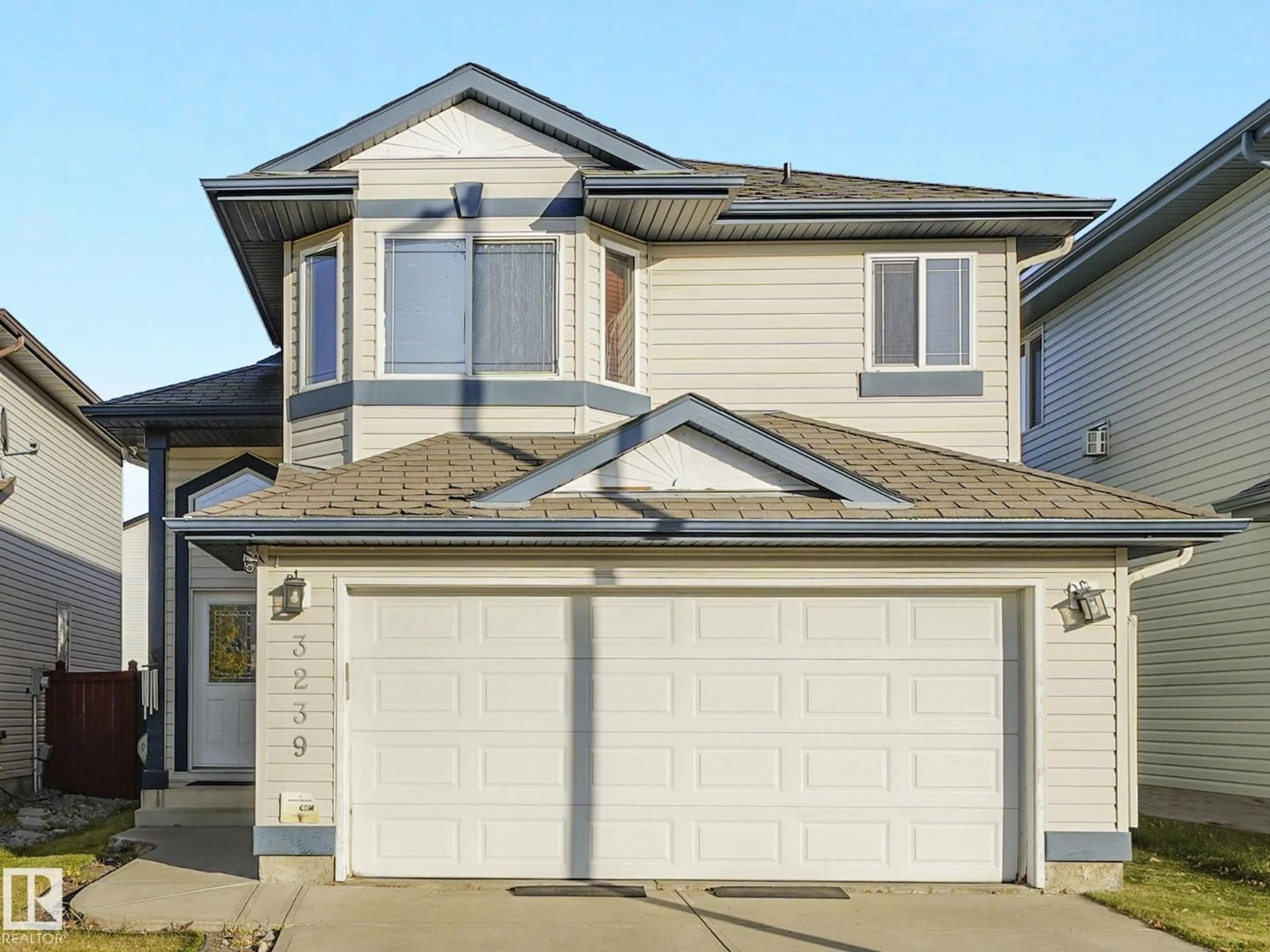 Home with vinyl exterior material, street for 3239 21 ST, Edmonton Alberta T6T0A8