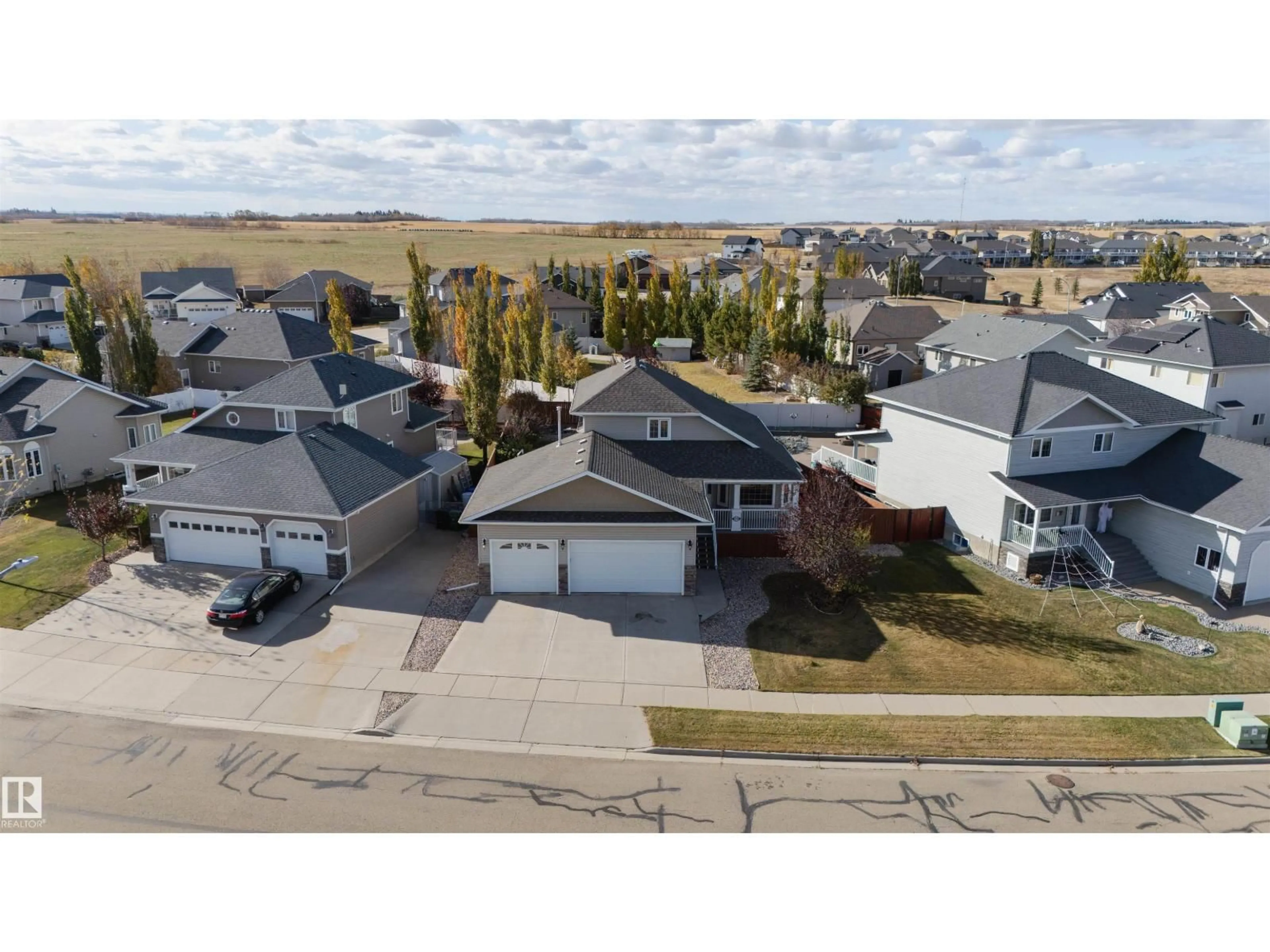 A pic from outside/outdoor area/front of a property/back of a property/a pic from drone, street for 3712 69 ST, Camrose Alberta T4V5B7