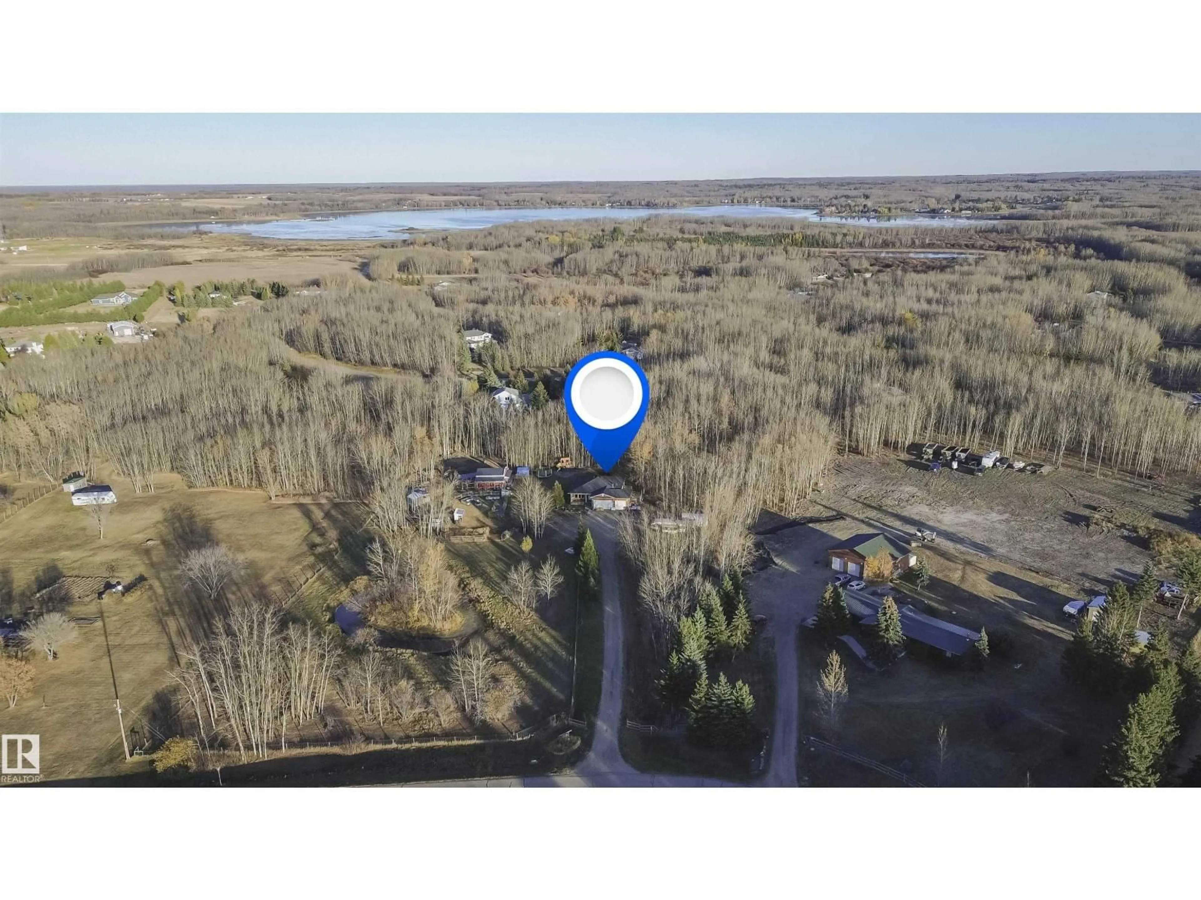 A pic from outside/outdoor area/front of a property/back of a property/a pic from drone, water/lake/river/ocean view for 109 - 52307 RGE ROAD 213, Rural Strathcona County Alberta T8G1C1