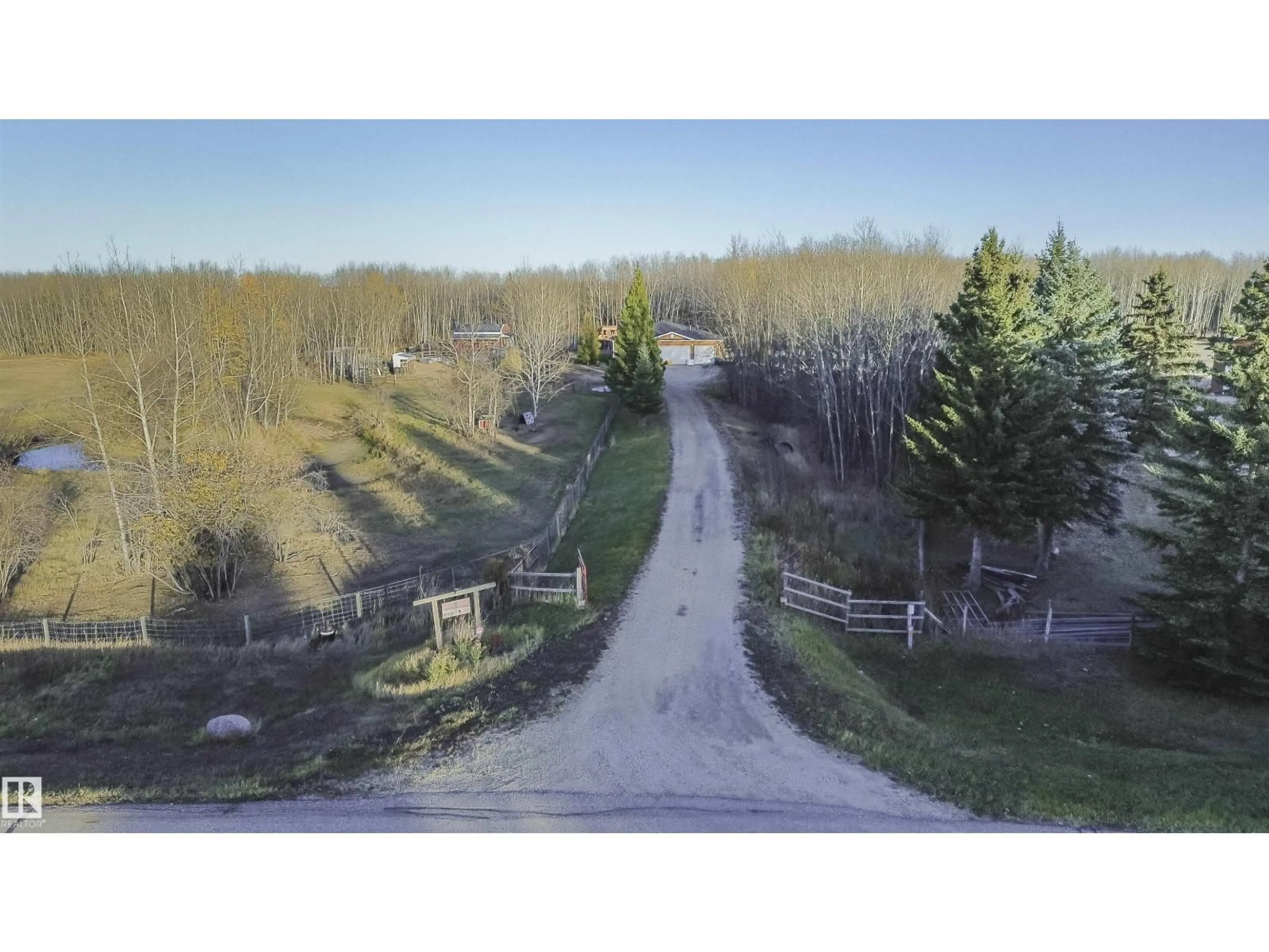 A pic from outside/outdoor area/front of a property/back of a property/a pic from drone, forest/trees view for 109 - 52307 RGE ROAD 213, Rural Strathcona County Alberta T8G1C1