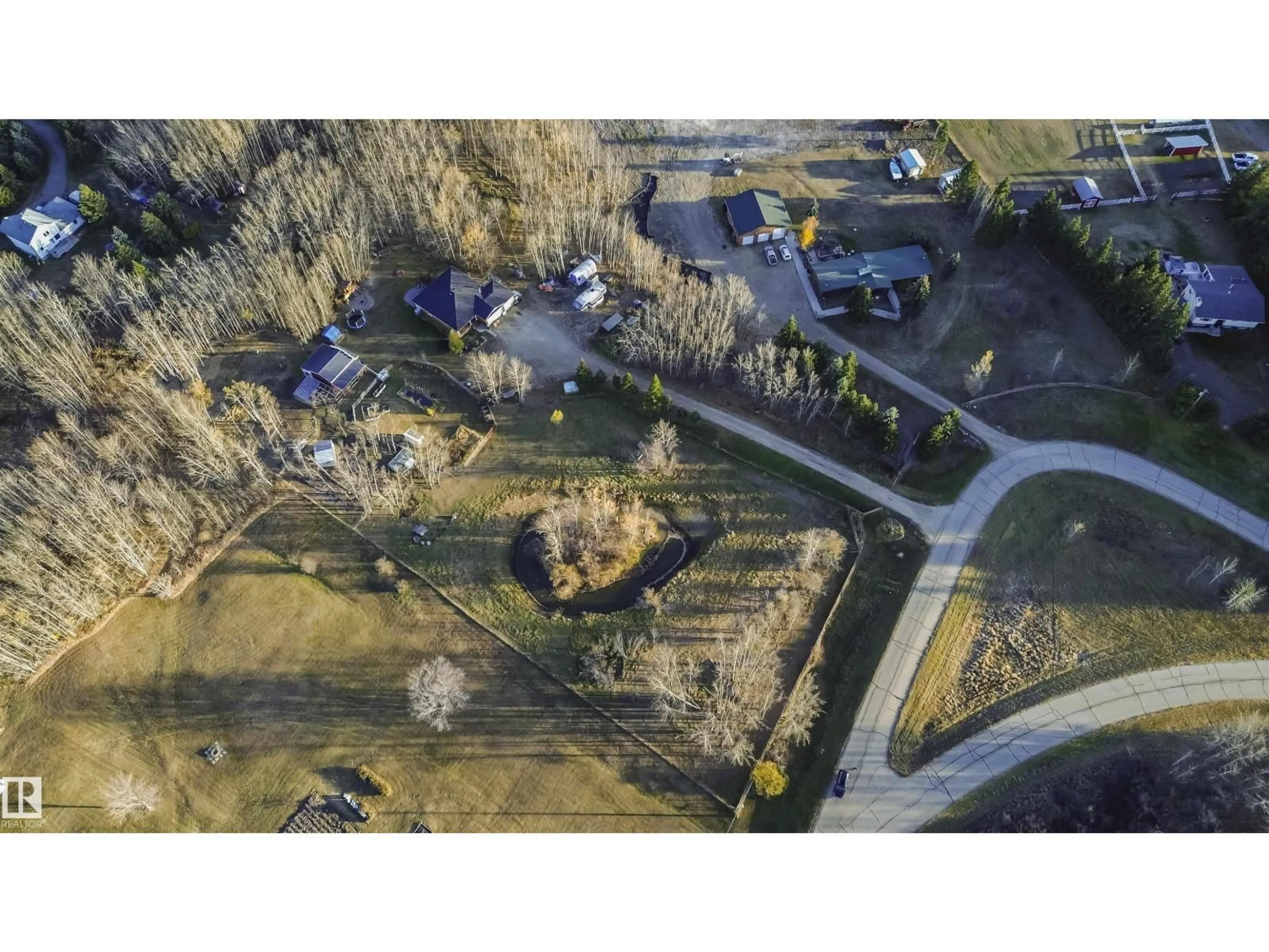 A pic from outside/outdoor area/front of a property/back of a property/a pic from drone, street for 109 - 52307 RGE ROAD 213, Rural Strathcona County Alberta T8G1C1