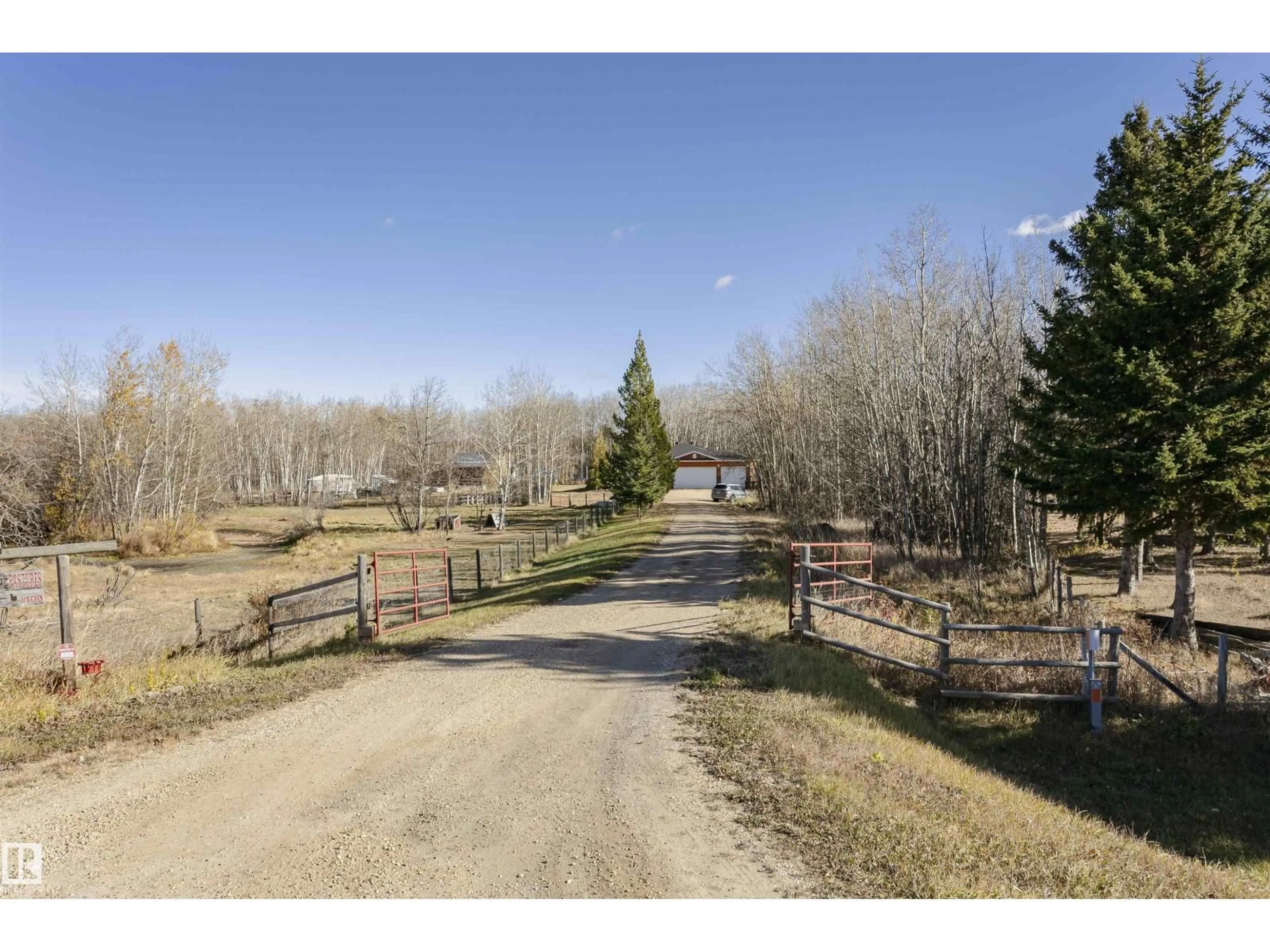 A pic from outside/outdoor area/front of a property/back of a property/a pic from drone, forest/trees view for 109 - 52307 RGE ROAD 213, Rural Strathcona County Alberta T8G1C1