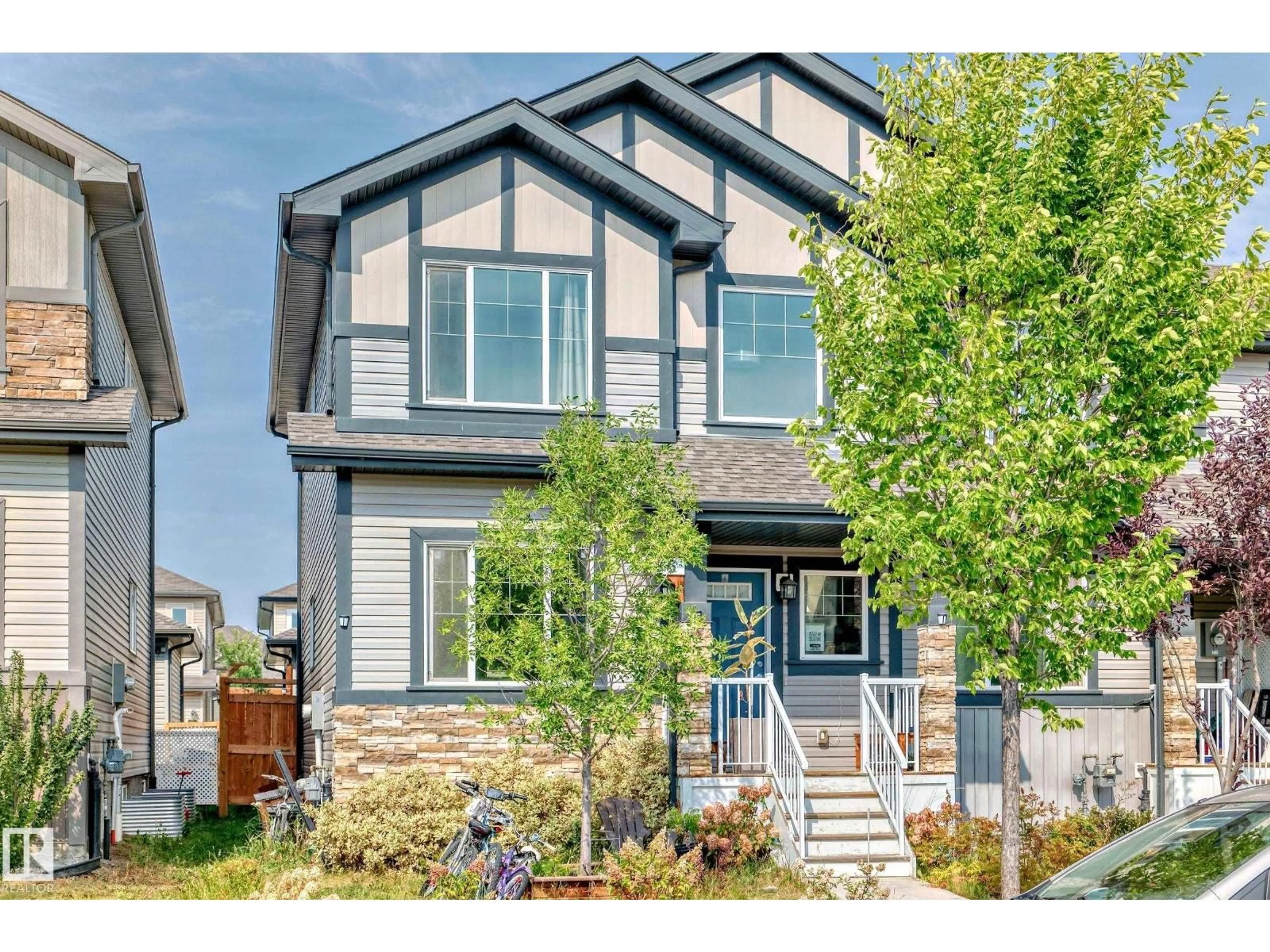 Home with vinyl exterior material, street for NW - 1426 26 AV, Edmonton Alberta T6T0W1