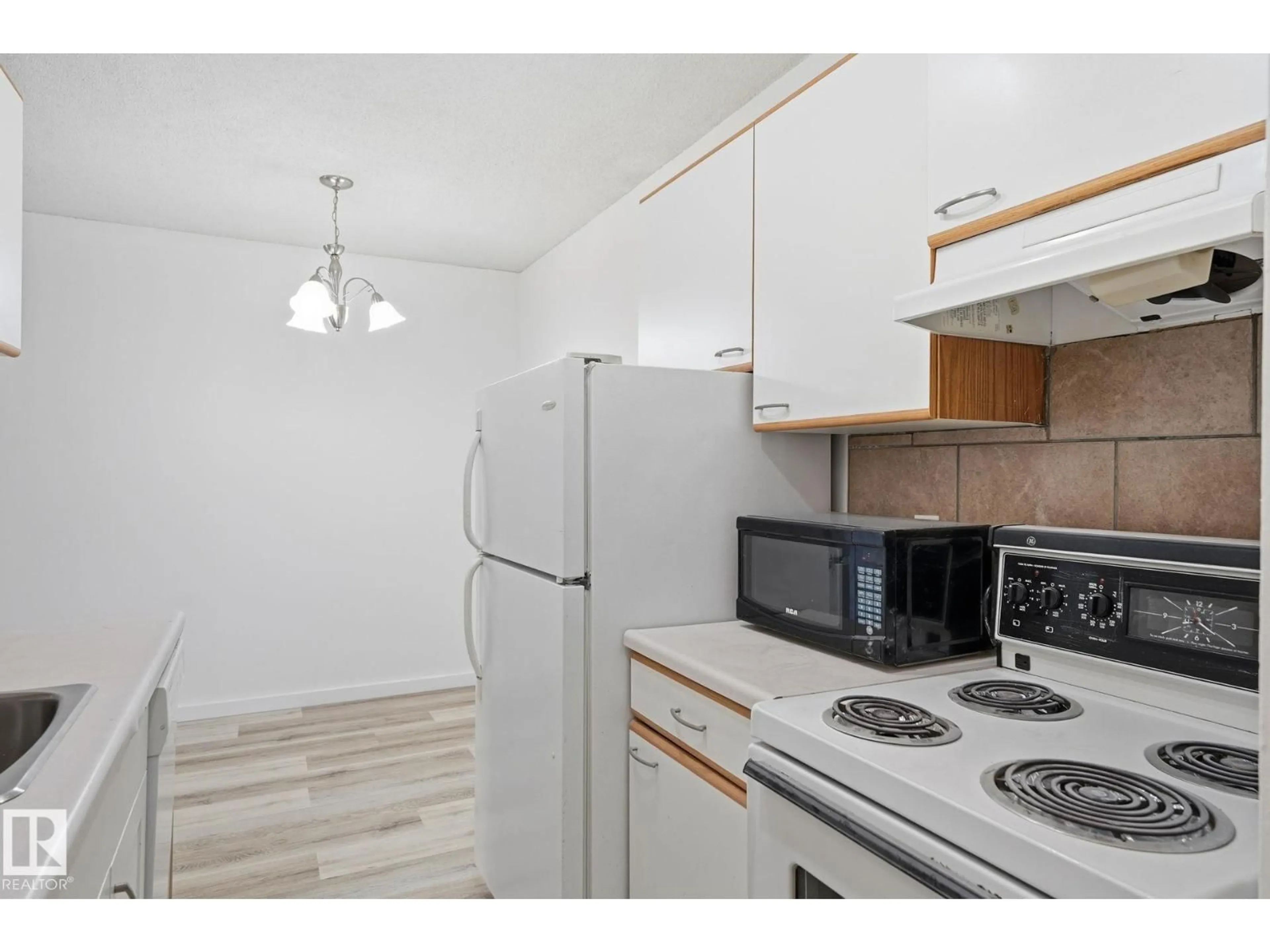 Standard kitchen, wood/laminate floor for 9028 - 205 JASPER AV, Edmonton Alberta T5H3Y6