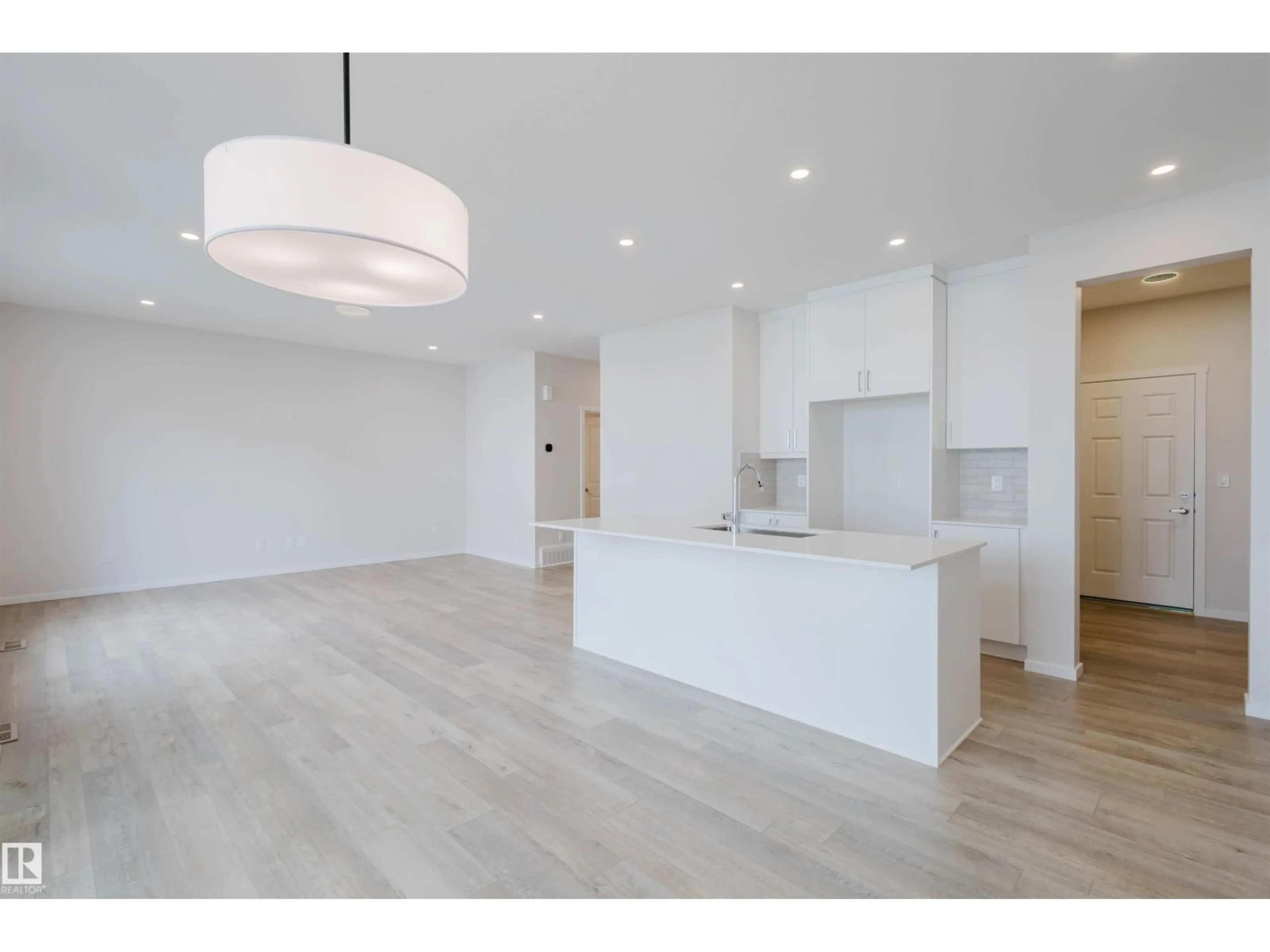 Open concept kitchen, wood/laminate floor for 1065 CORNERSTONE WY, Sherwood Park Alberta T8H3A3