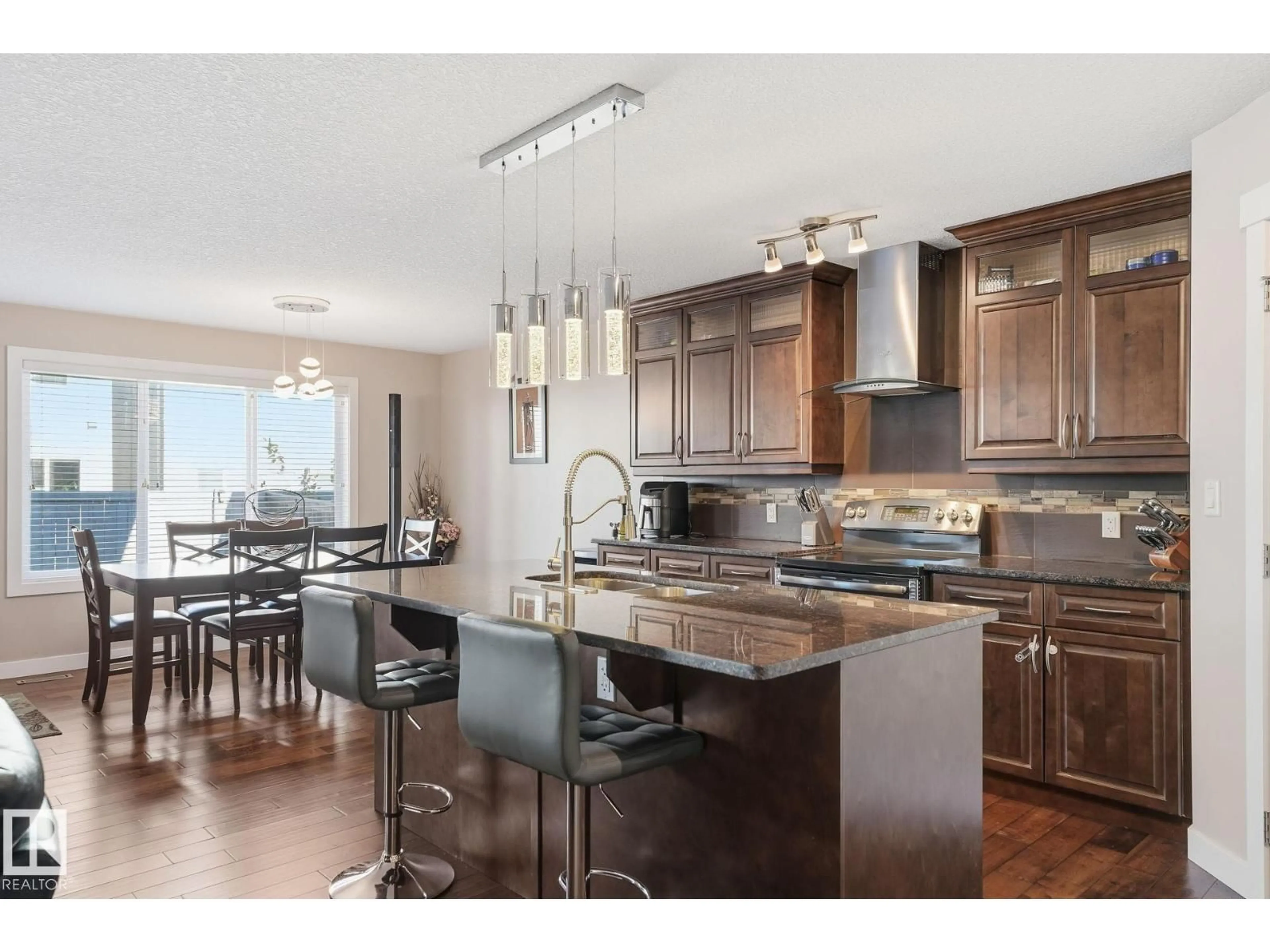 Open concept kitchen, wood/laminate floor for 8710 180A AV, Edmonton Alberta T5Z0G6