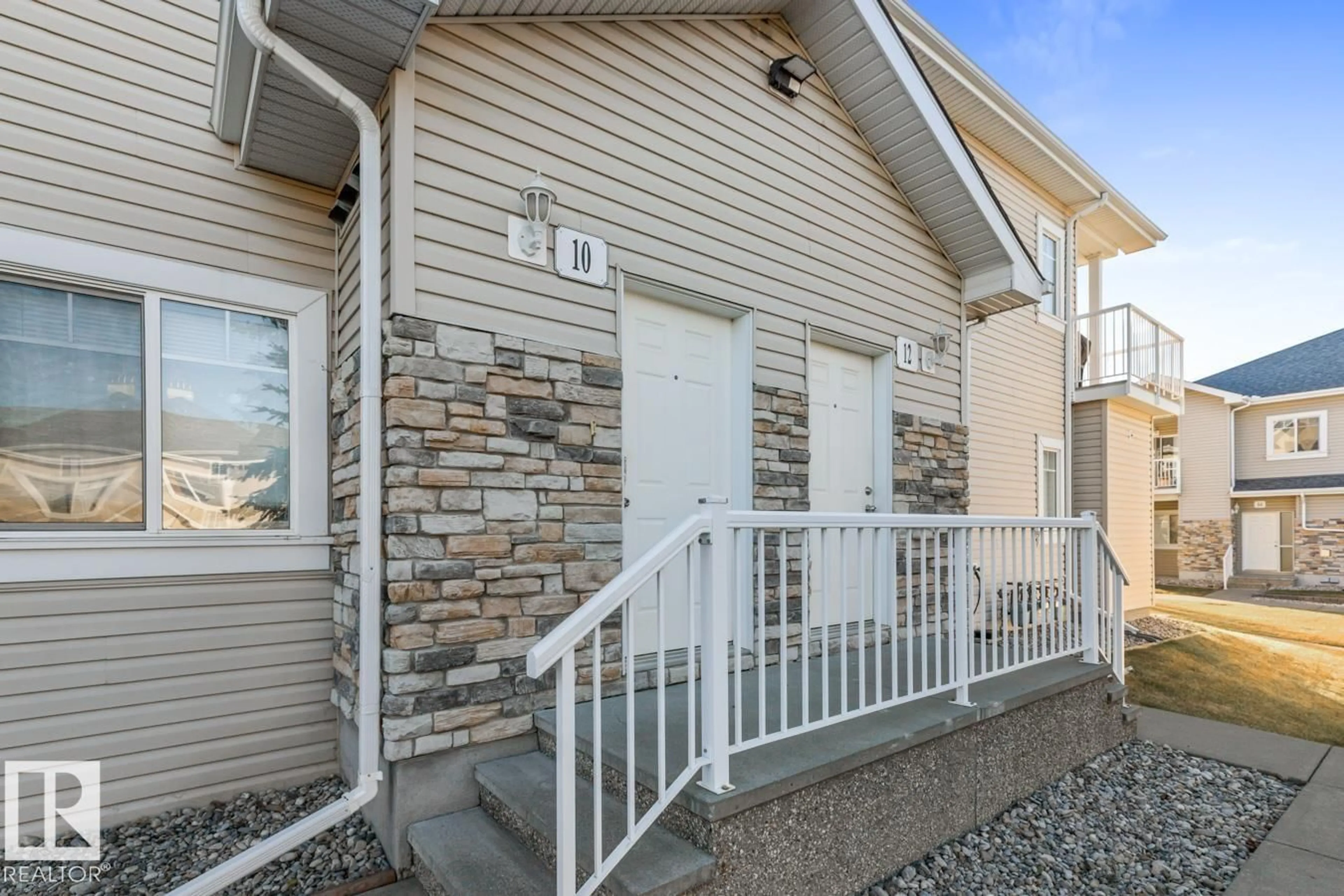 Home with vinyl exterior material, street for #10 - 2508 HANNA CR, Edmonton Alberta T6R3N7