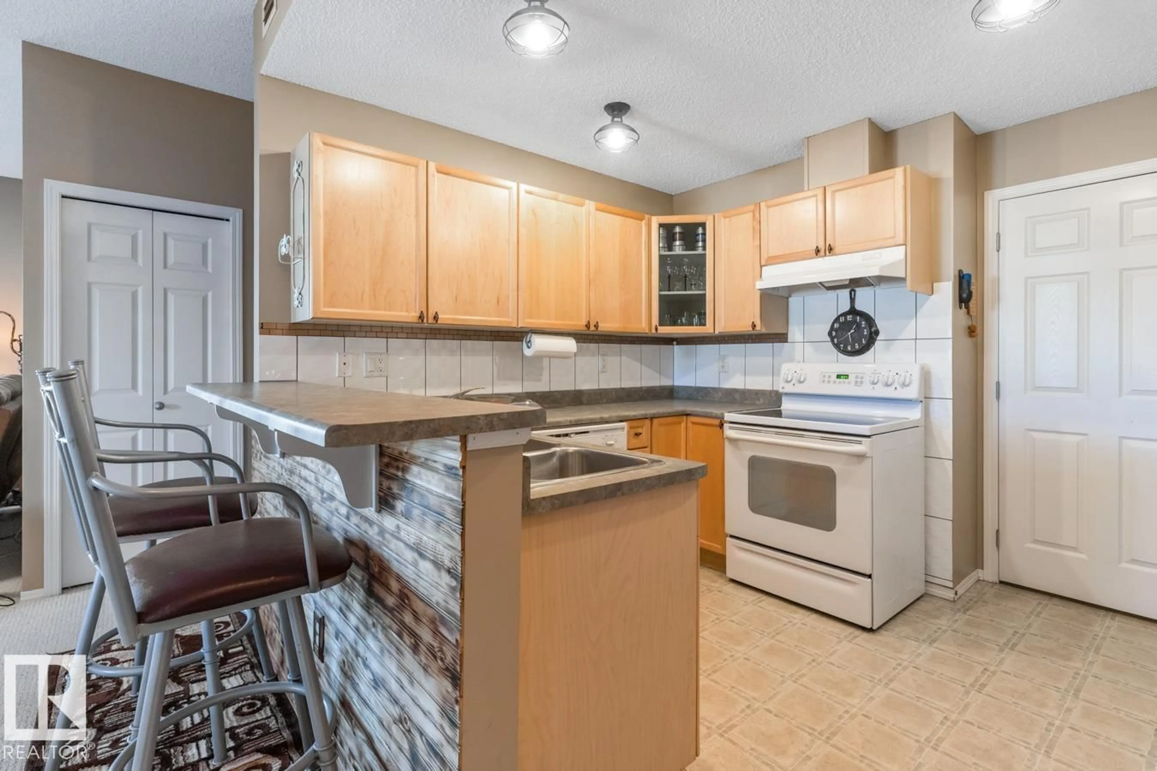 Standard kitchen, ceramic/tile floor for #10 - 2508 HANNA CR, Edmonton Alberta T6R3N7