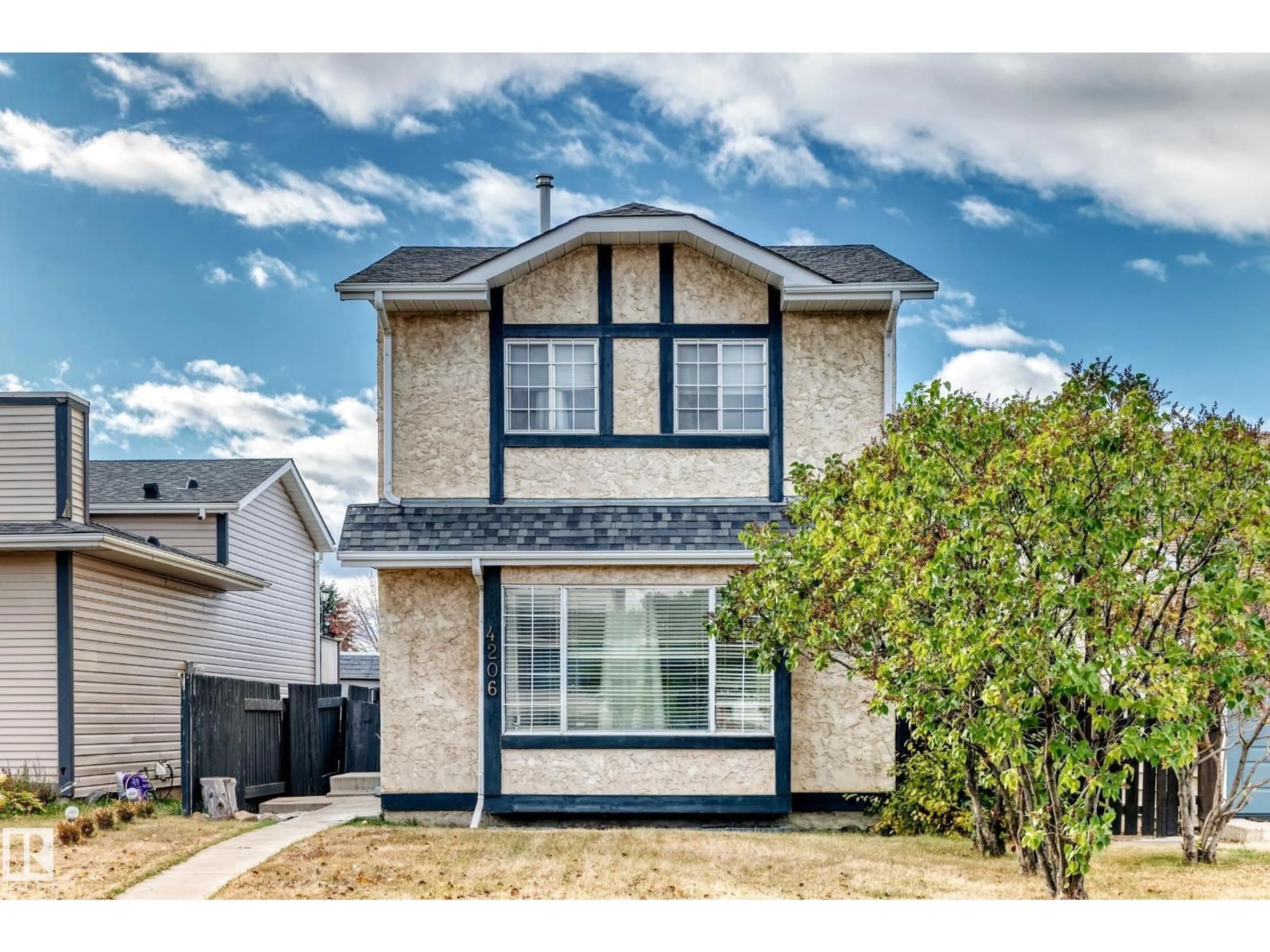 Home with vinyl exterior material, street for 4206 38 ST, Edmonton Alberta T6L4K4