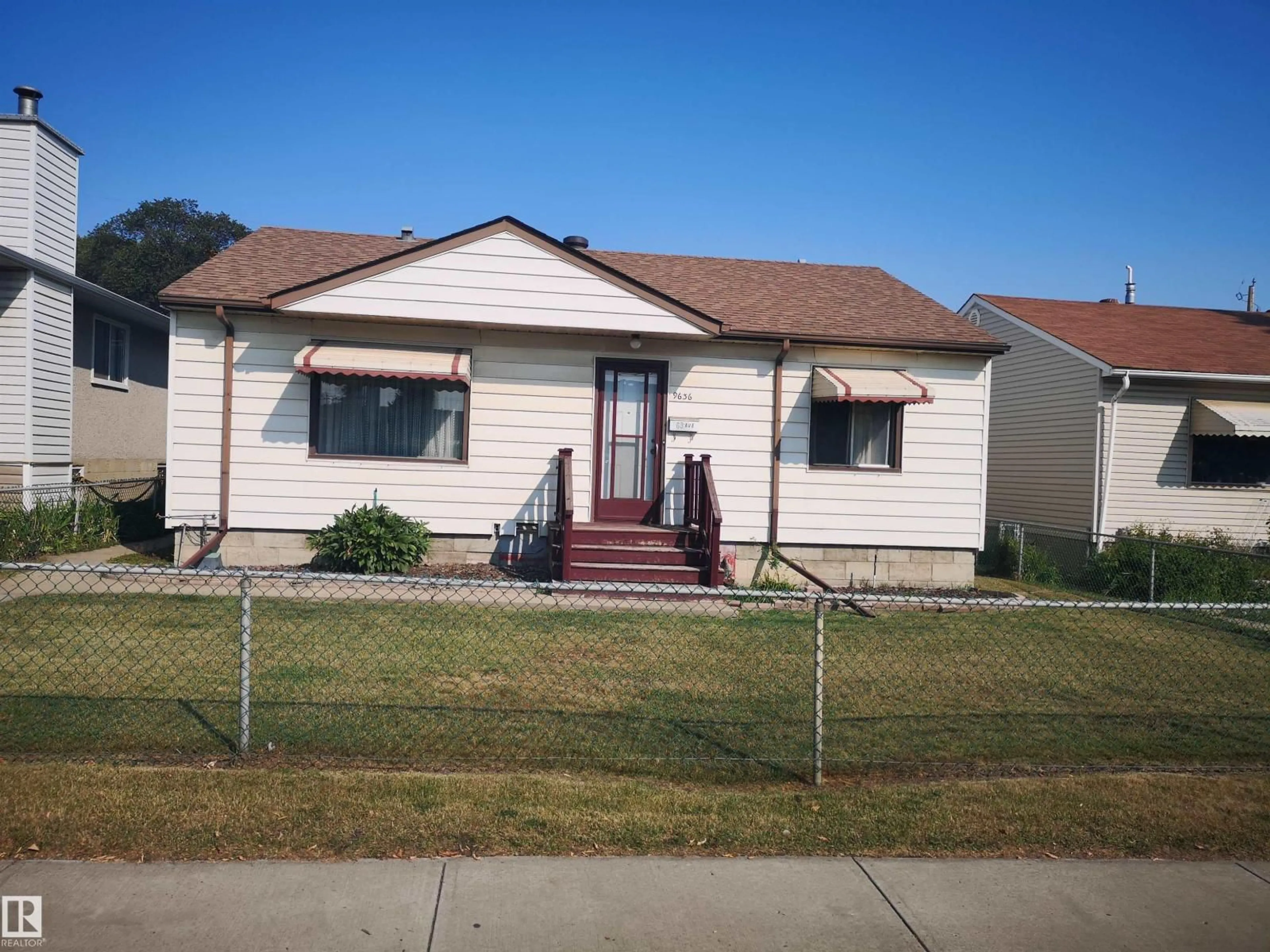 Home with vinyl exterior material, street for 9636 63 AV, Edmonton Alberta T6E0G5