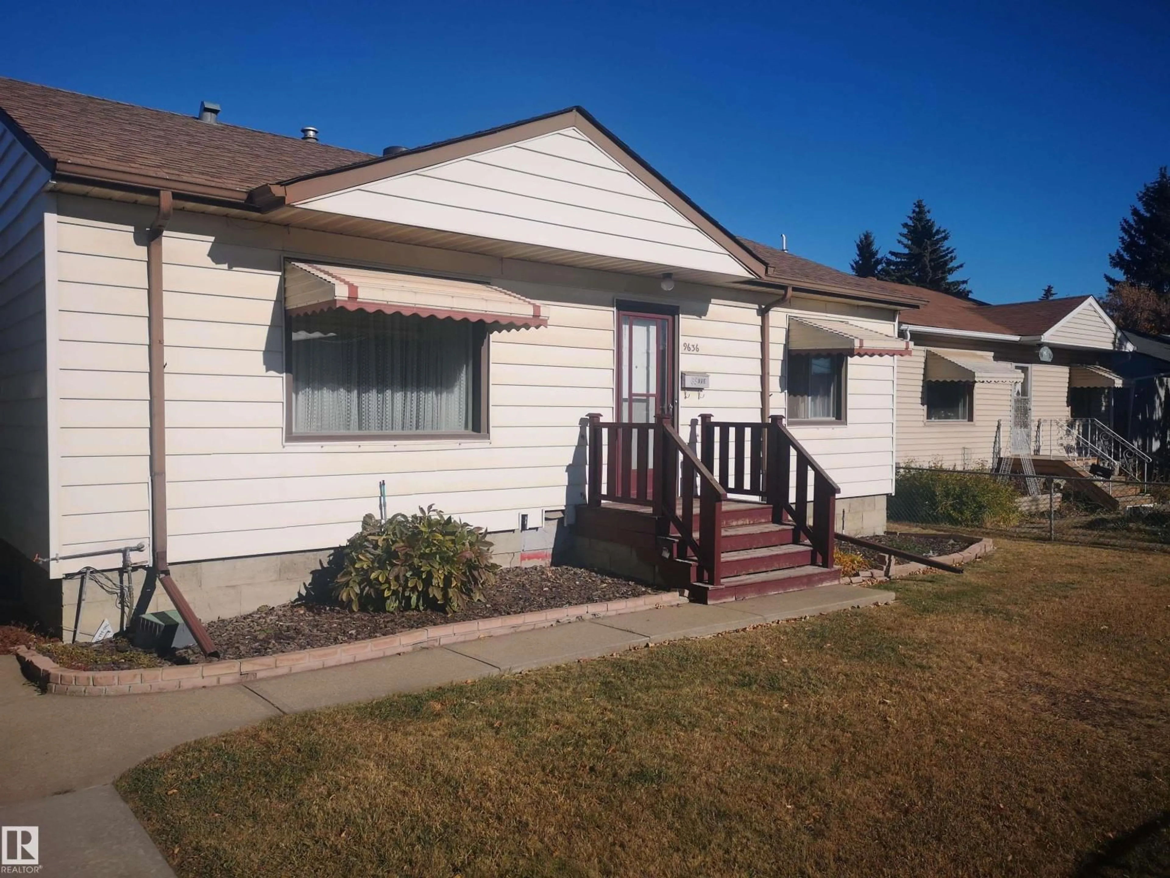 Home with vinyl exterior material, street for 9636 63 AV, Edmonton Alberta T6E0G5