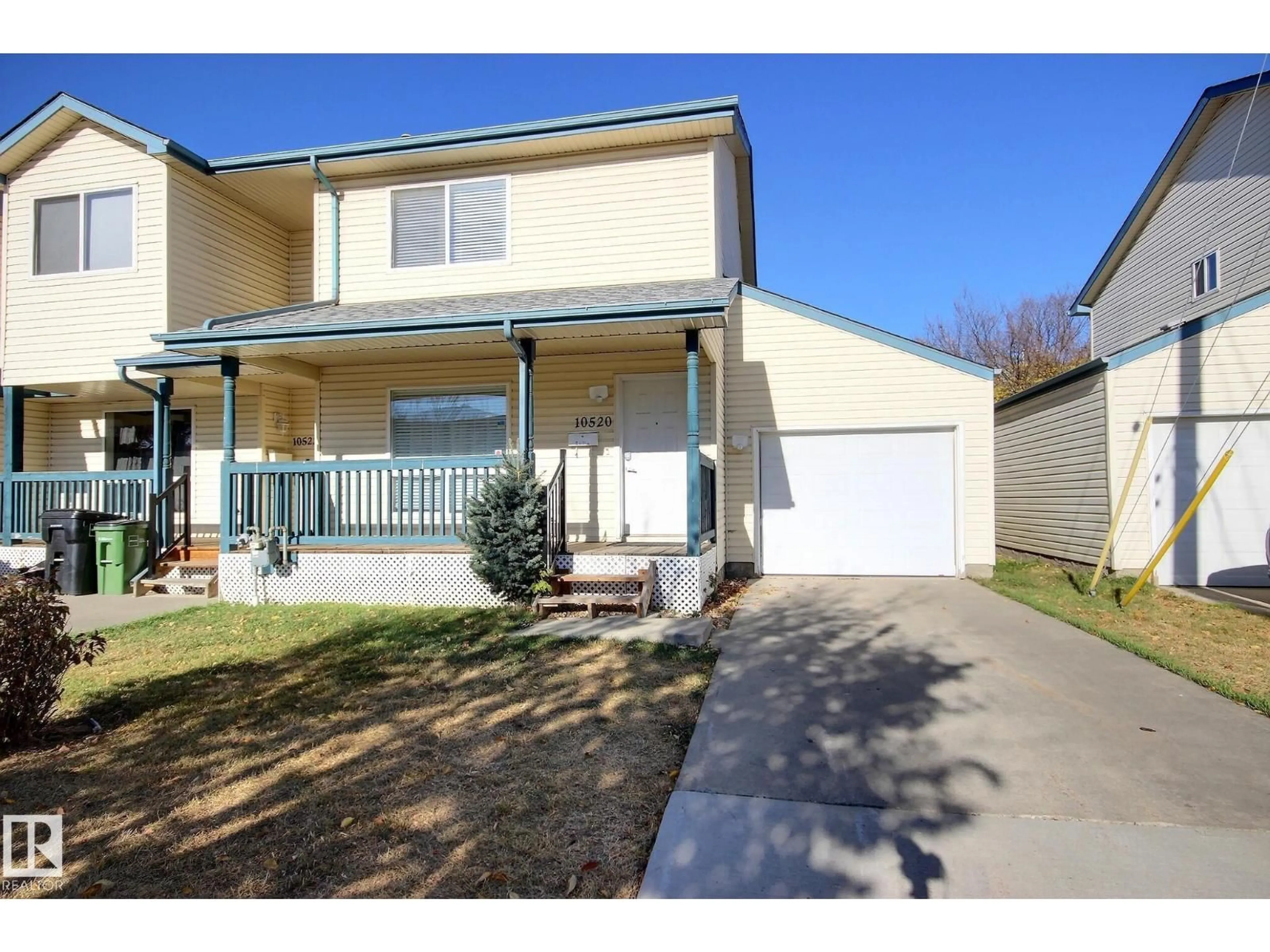 Home with vinyl exterior material, street for 10520 108 AV, Edmonton Alberta T5H4H8