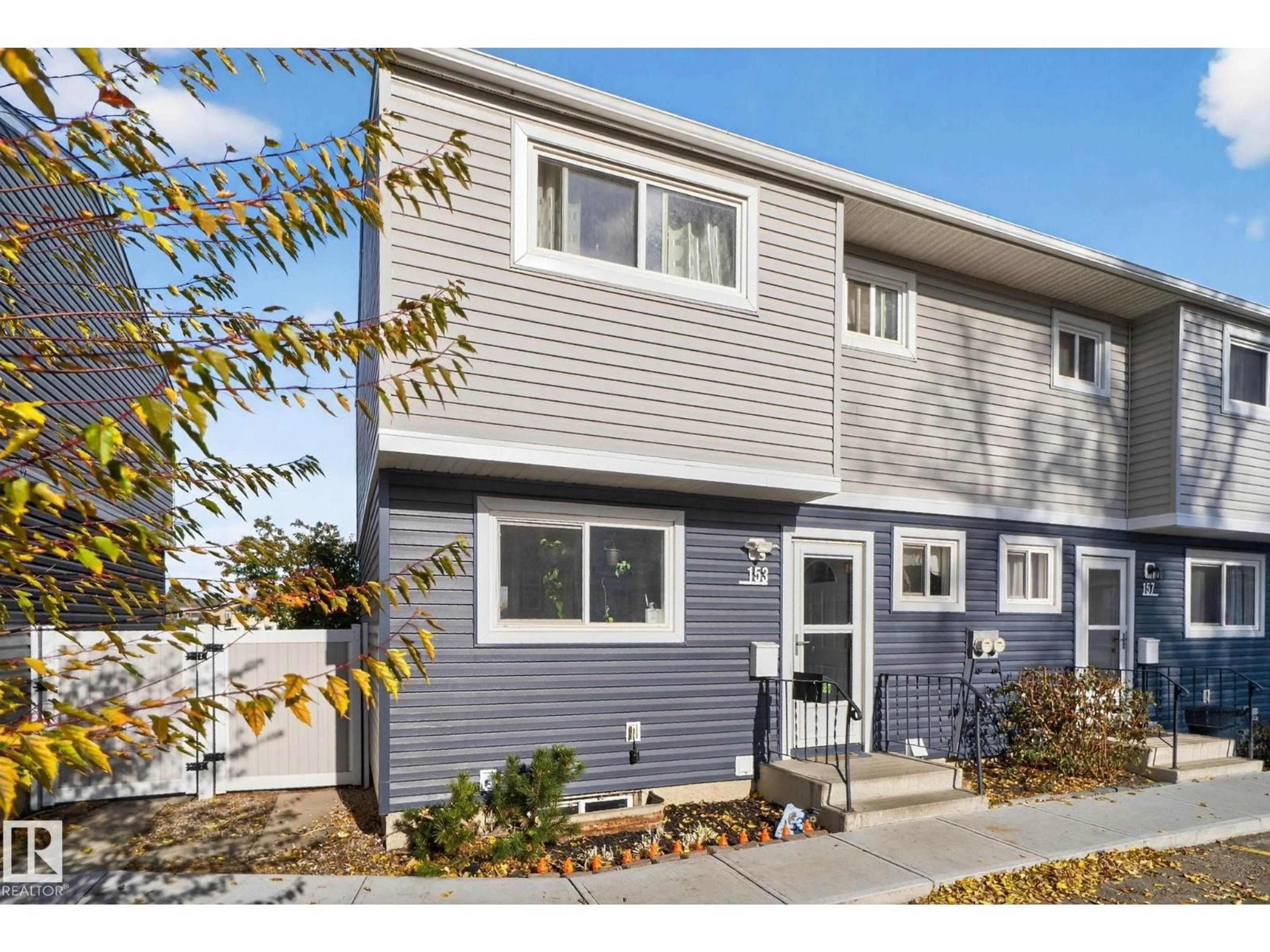 Home with vinyl exterior material, street for 153 HABITAT CR, Edmonton Alberta T5A3K8