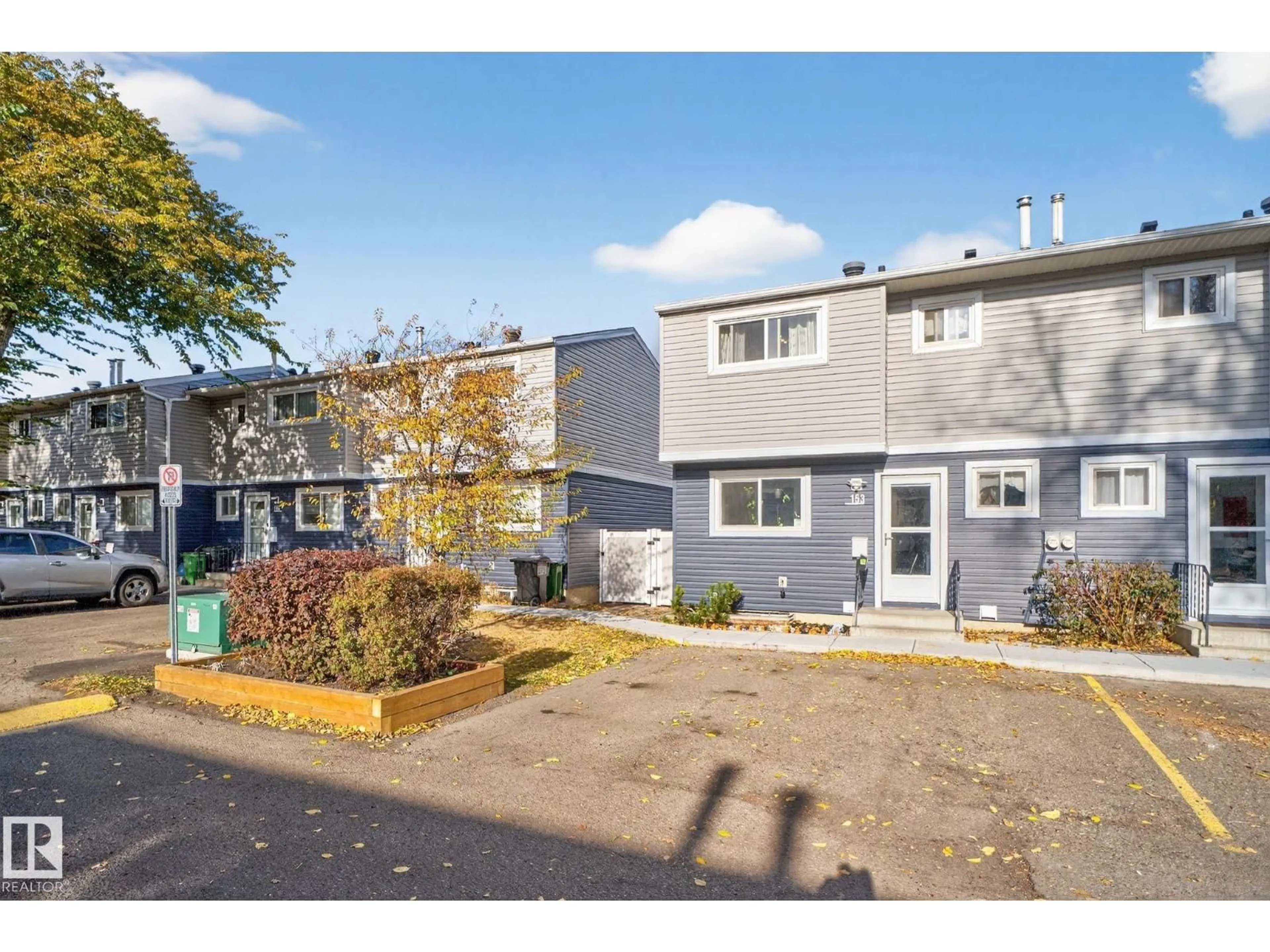 Home with vinyl exterior material, street for 153 HABITAT CR, Edmonton Alberta T5A3K8