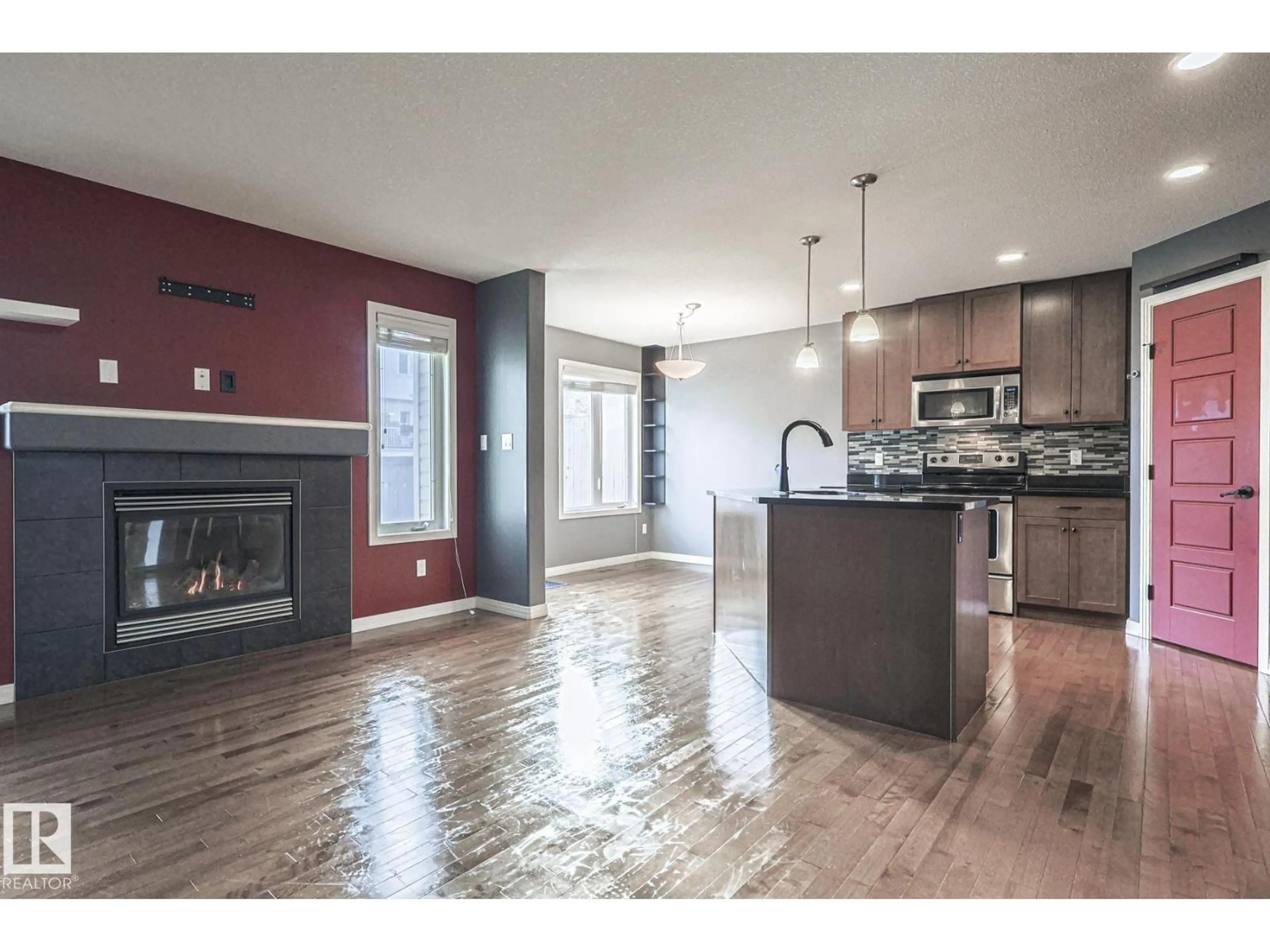 Open concept kitchen, wood/laminate floor for 819 172 ST, Edmonton Alberta T6W0M6