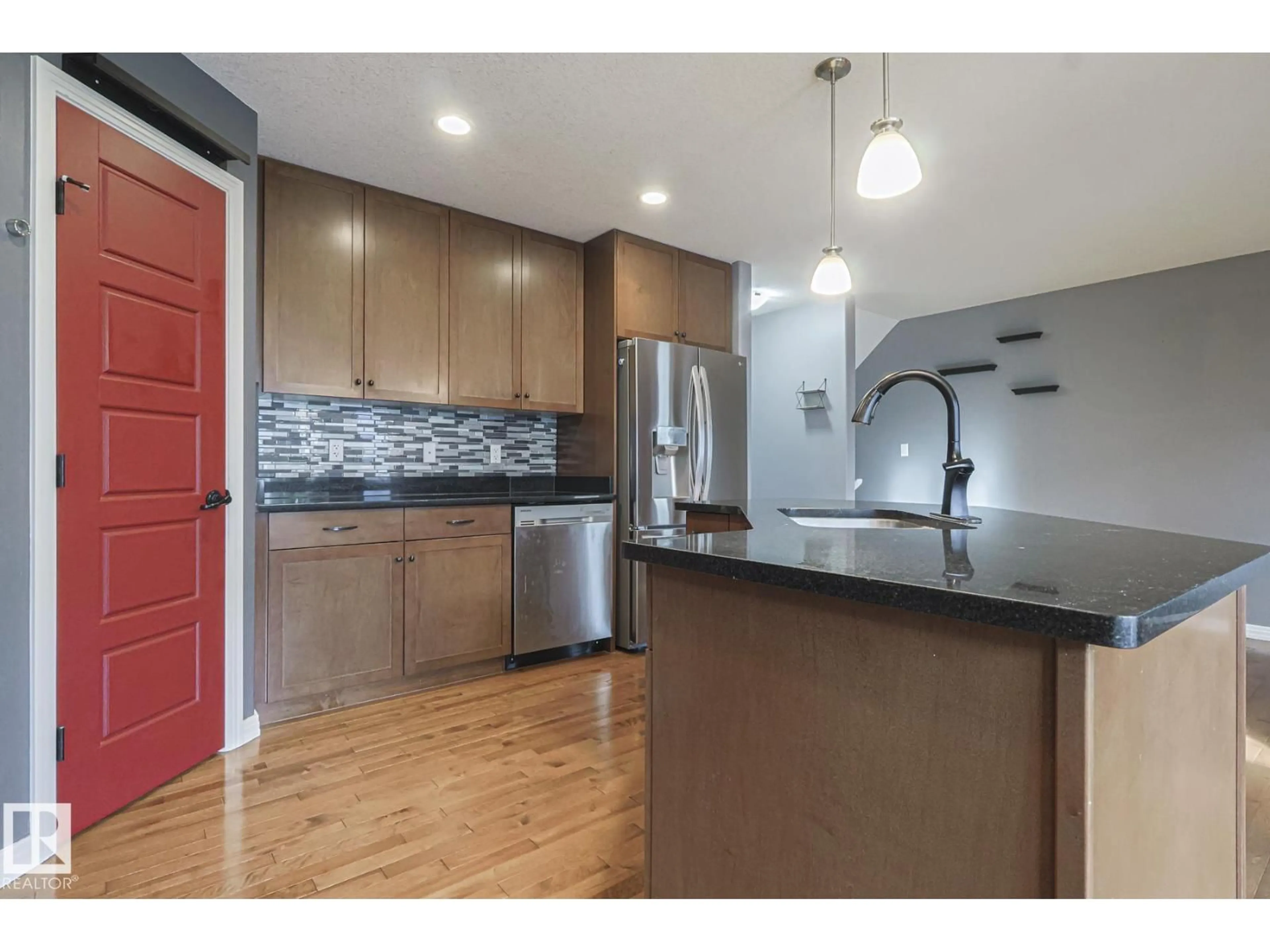 Open concept kitchen, wood/laminate floor for 819 172 ST, Edmonton Alberta T6W0M6