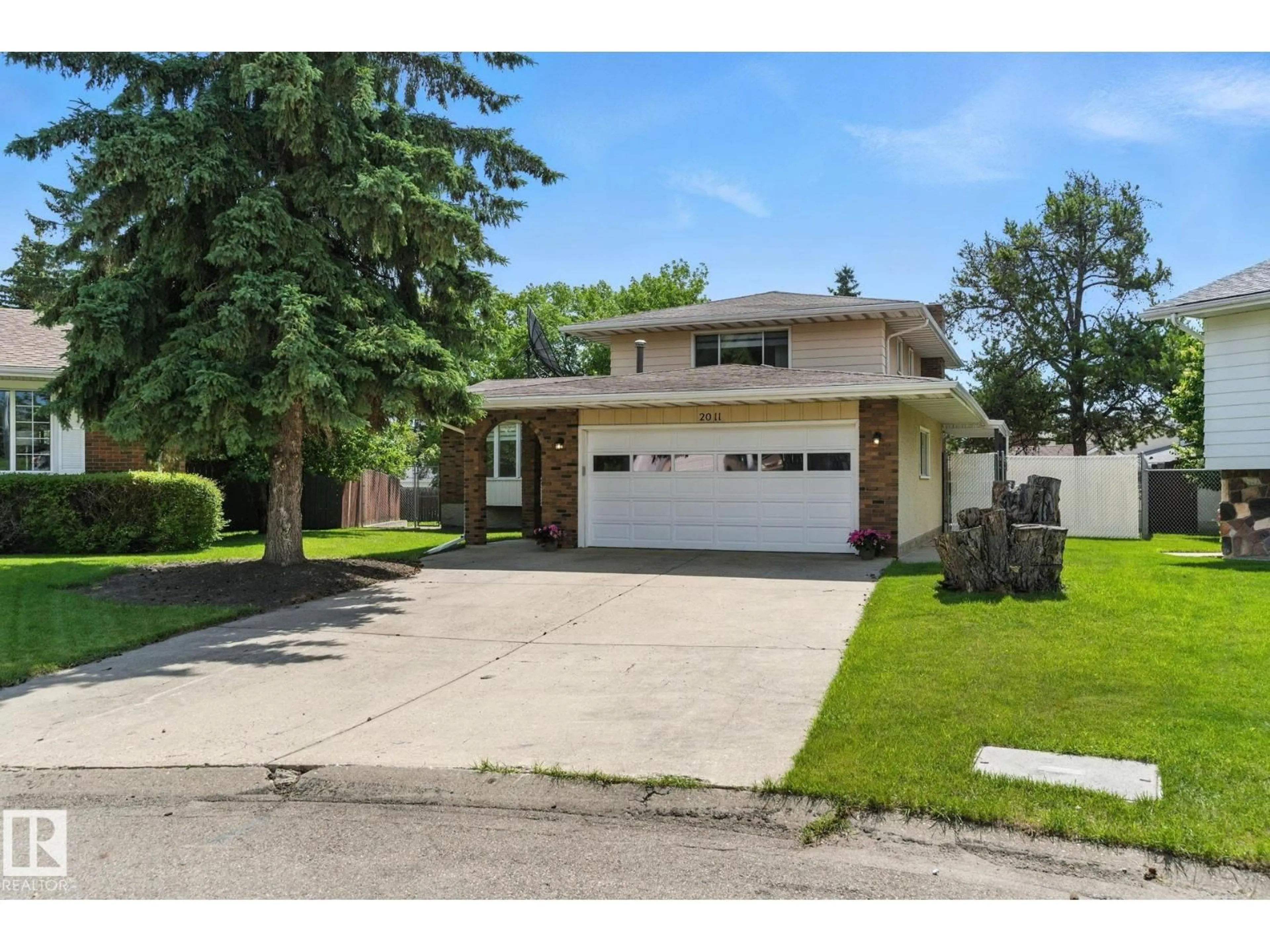 Home with brick exterior material, street for NW - 2011 89 ST, Edmonton Alberta T6K2A2