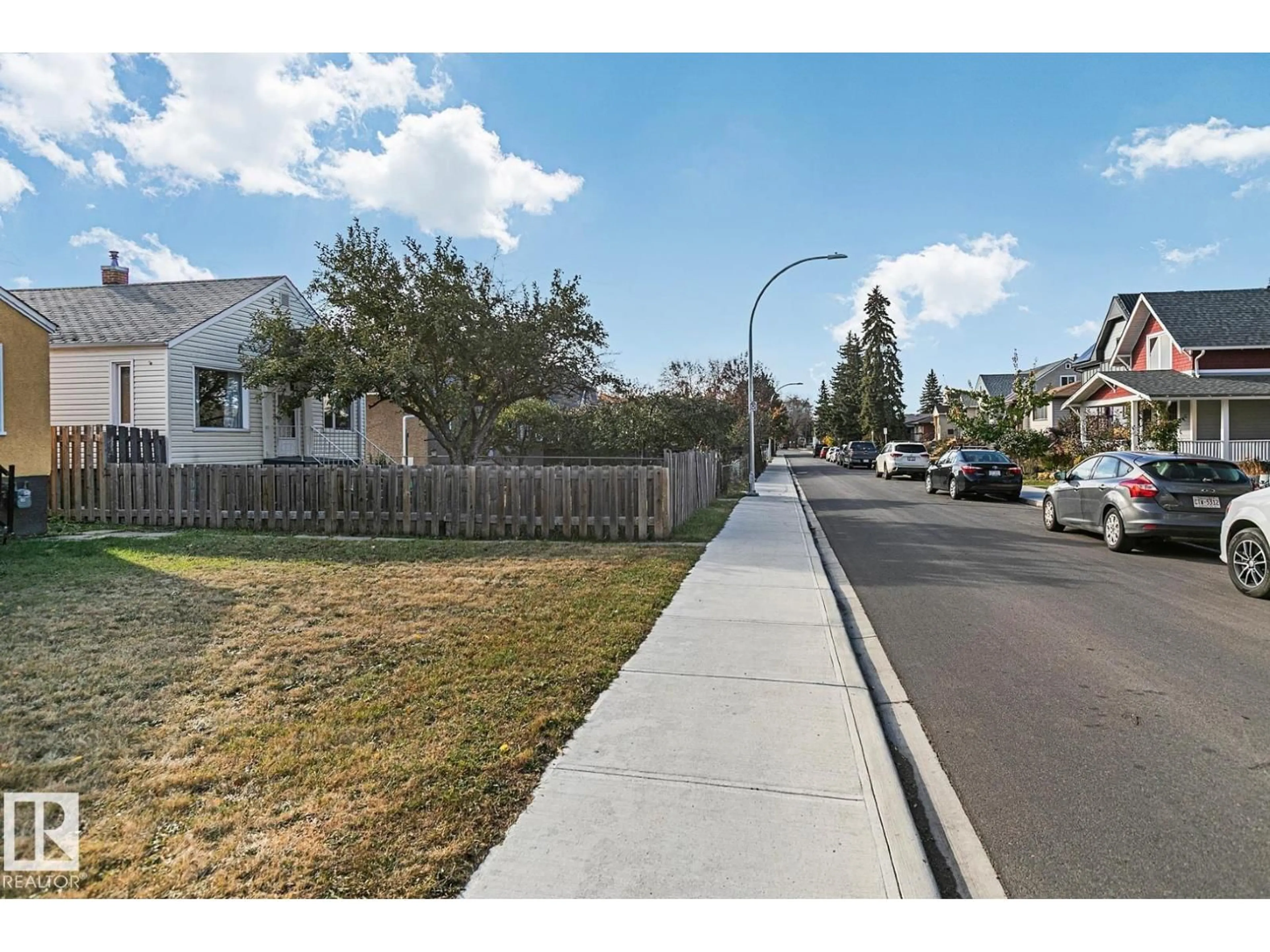 A pic from outside/outdoor area/front of a property/back of a property/a pic from drone, street for 9221 110 AV, Edmonton Alberta T5H1H2