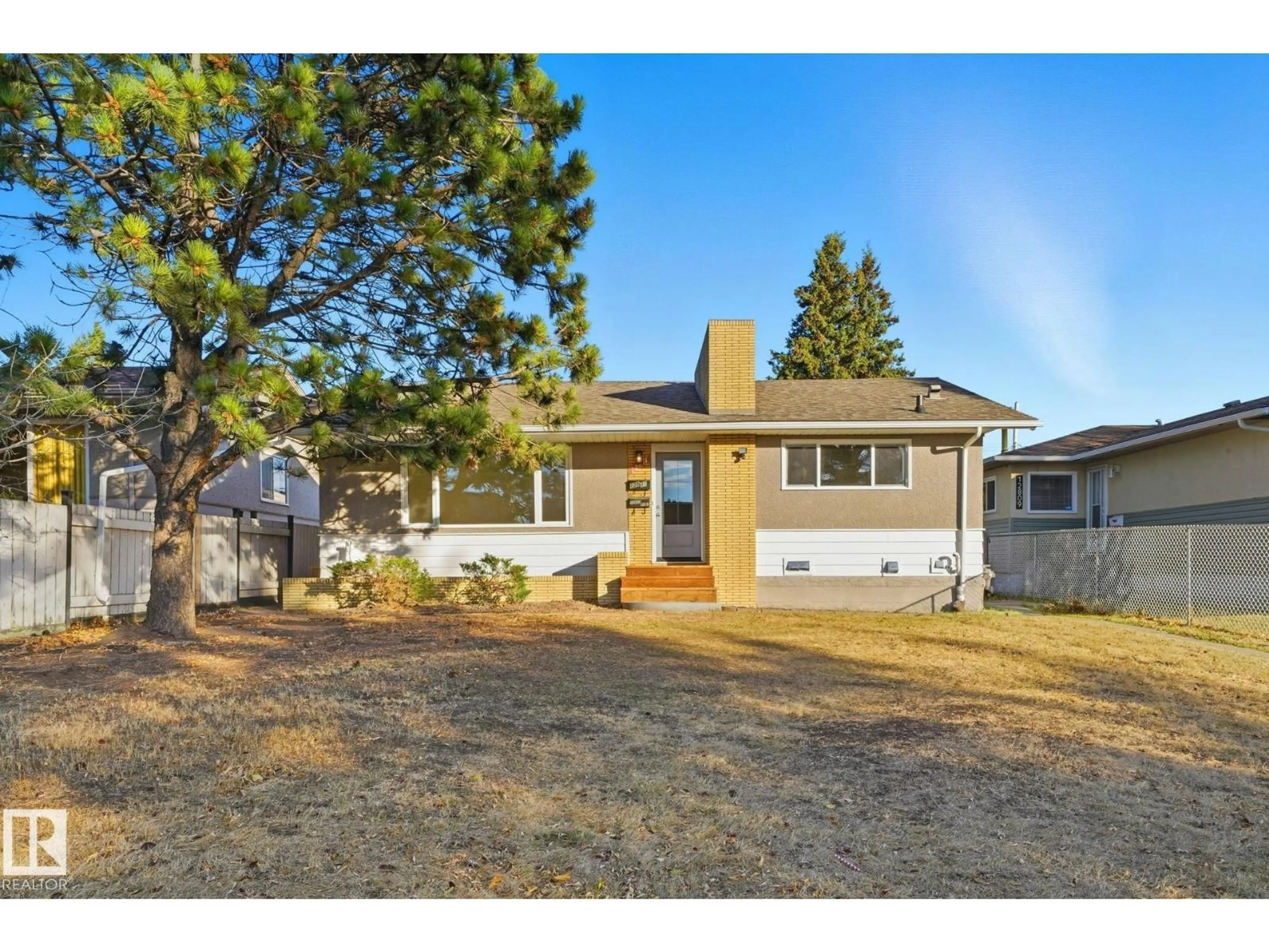 Home with vinyl exterior material, street for 12811 89 ST, Edmonton Alberta T5E3J8