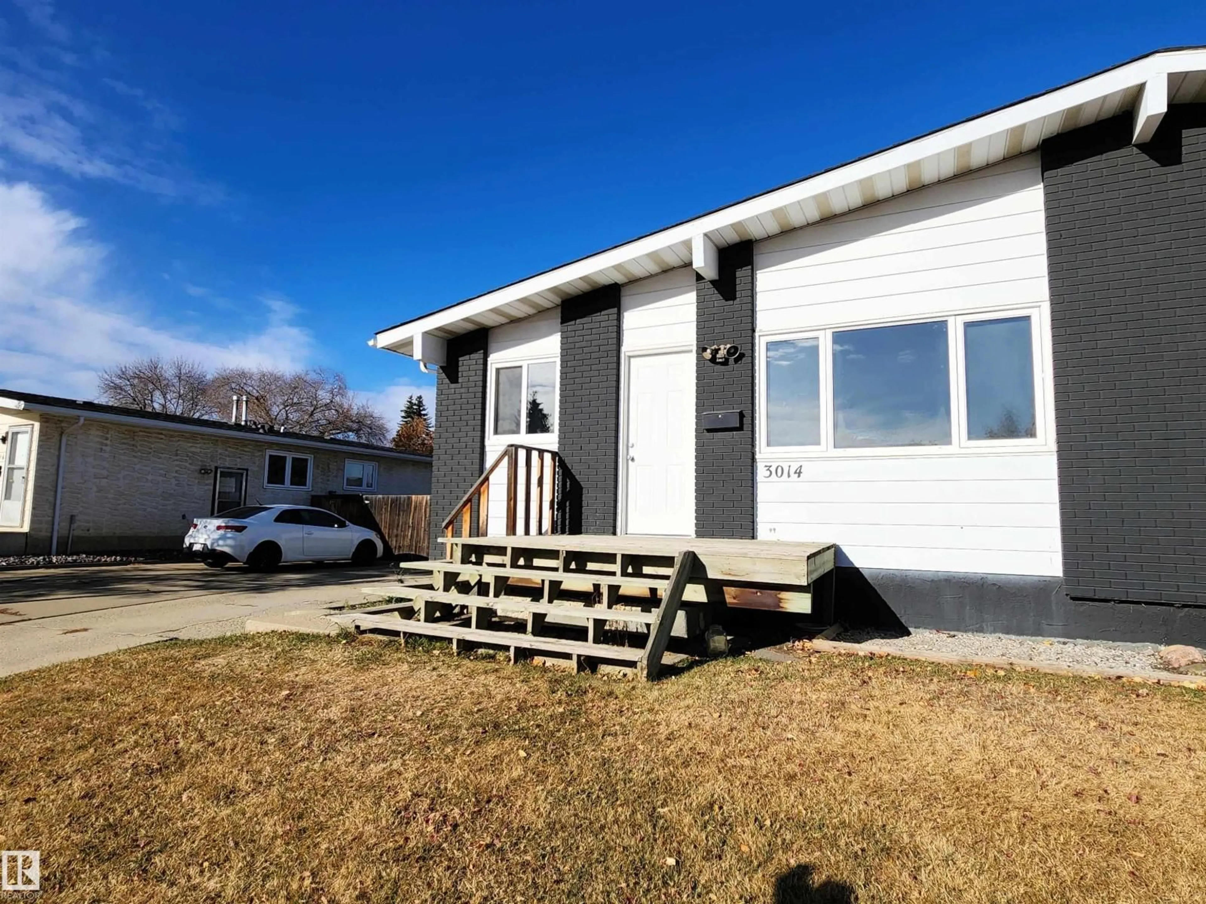 Home with vinyl exterior material, building for NW - 3014 132 AV, Edmonton Alberta T5A2Z1
