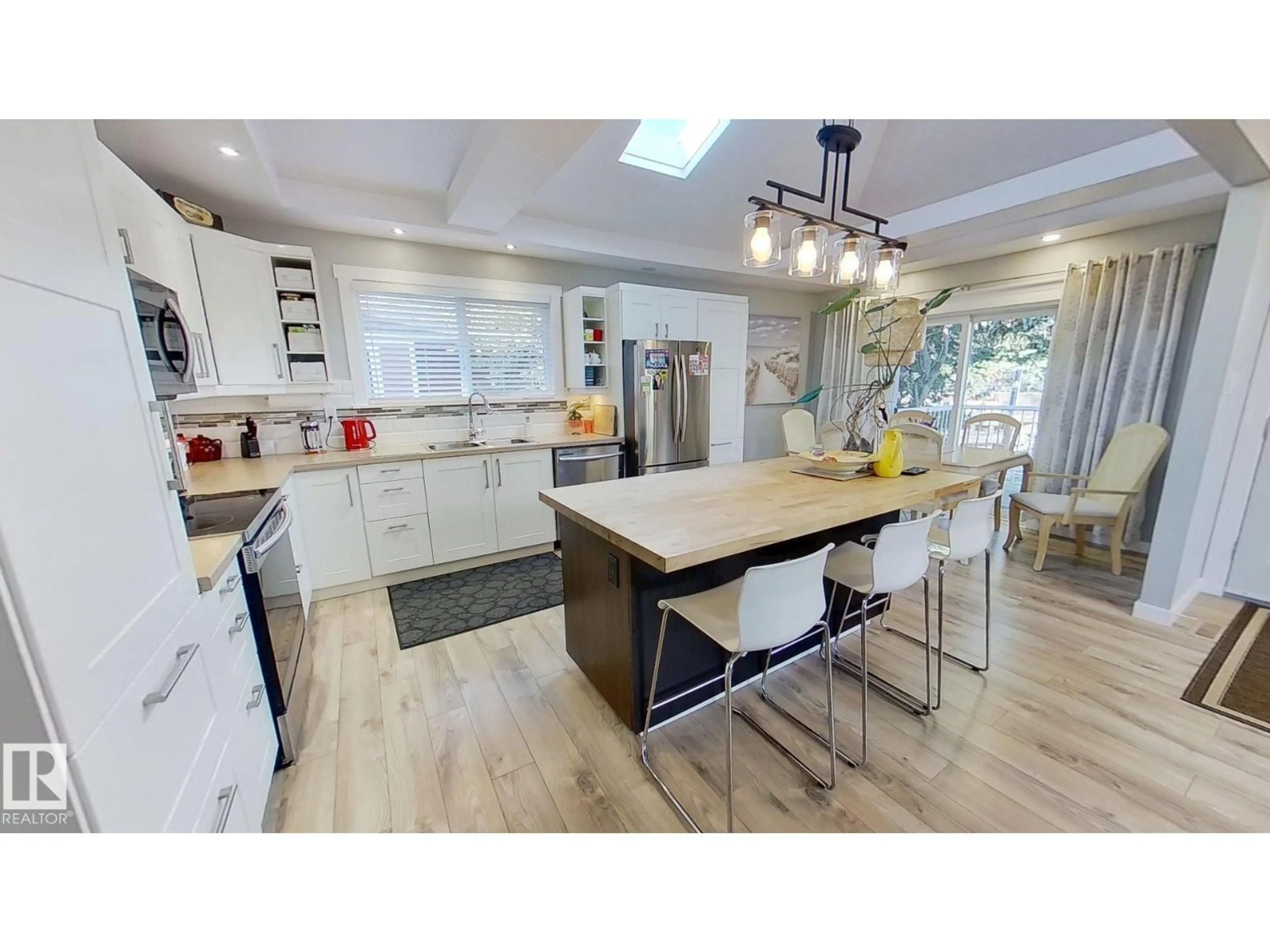 Open concept kitchen, wood/laminate floor for 2 ATHAPASKAN DR, Leduc Alberta T9E4K3