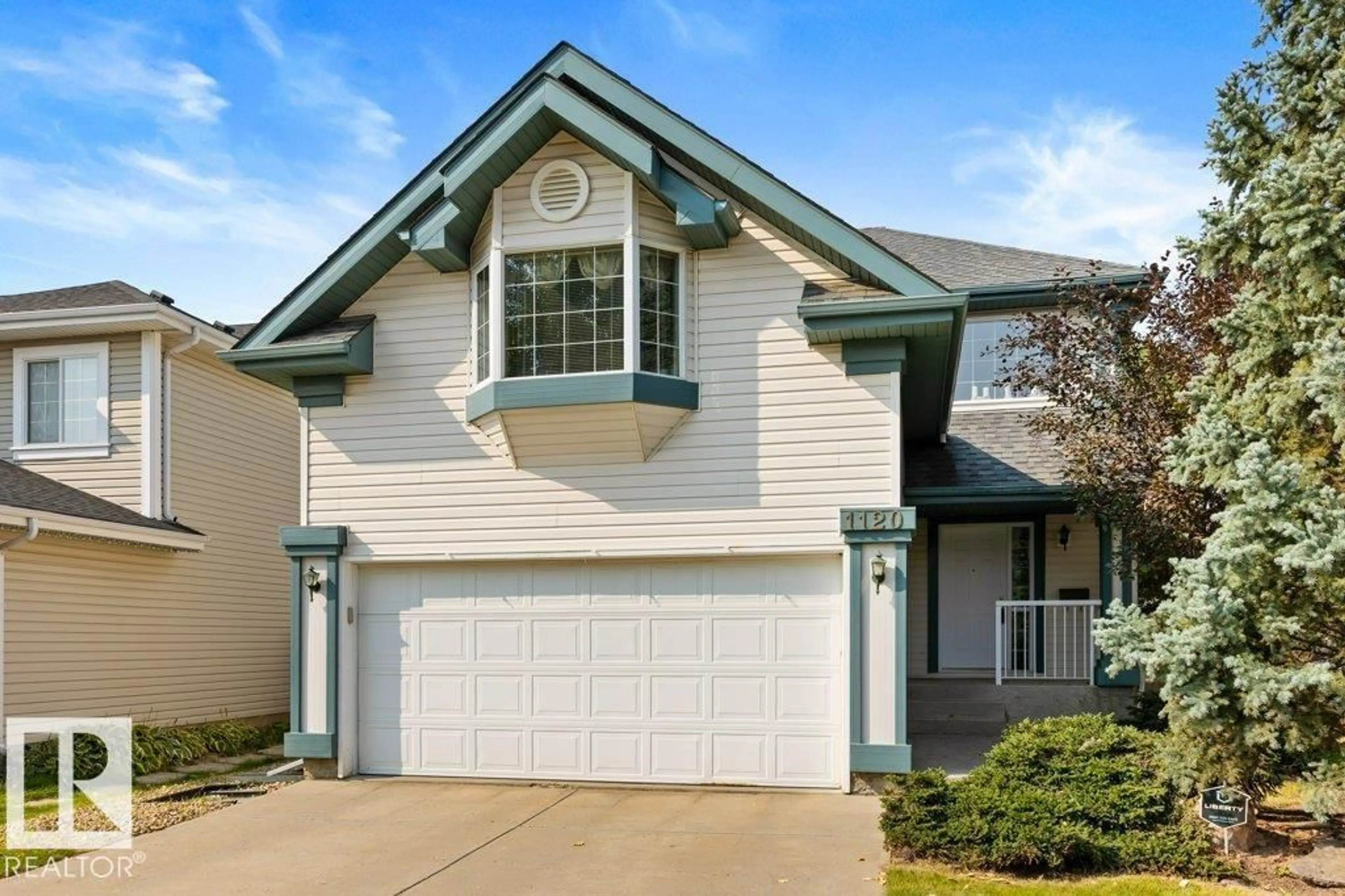 Home with vinyl exterior material, street for 1120 118A ST NW, Edmonton Alberta T6J7C4