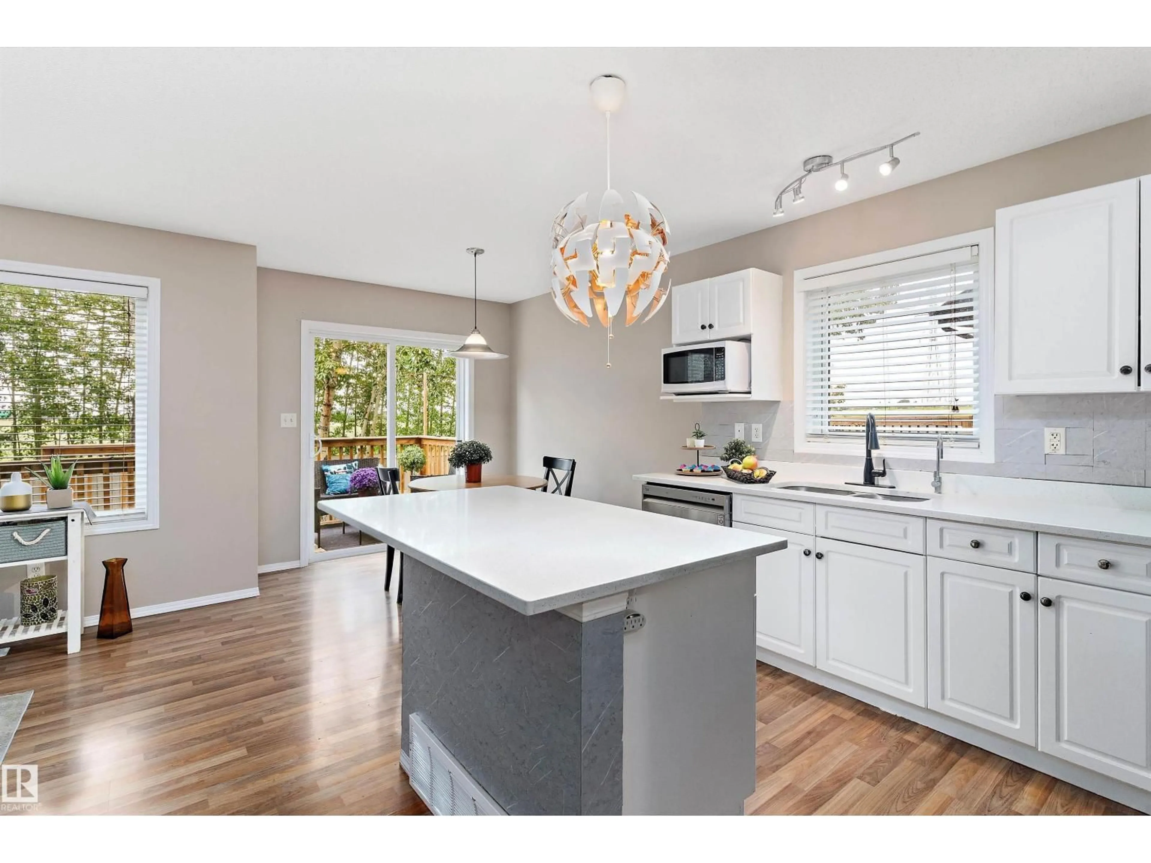 Open concept kitchen, wood/laminate floor for SW - 6232 1A AV, Edmonton Alberta T6X0C1