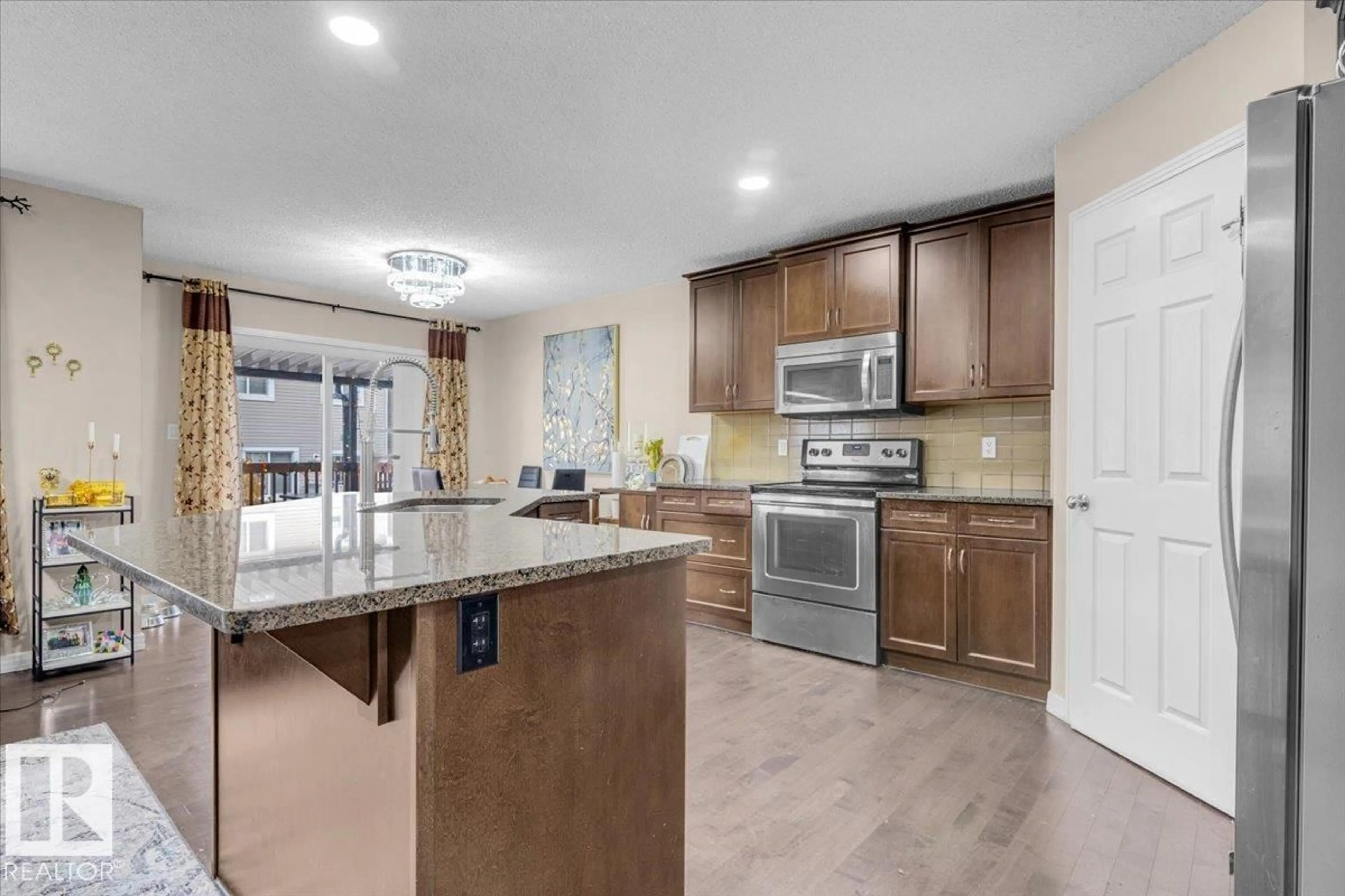 Open concept kitchen, ceramic/tile floor for 5516 5 AV, Edmonton Alberta T6X1R9