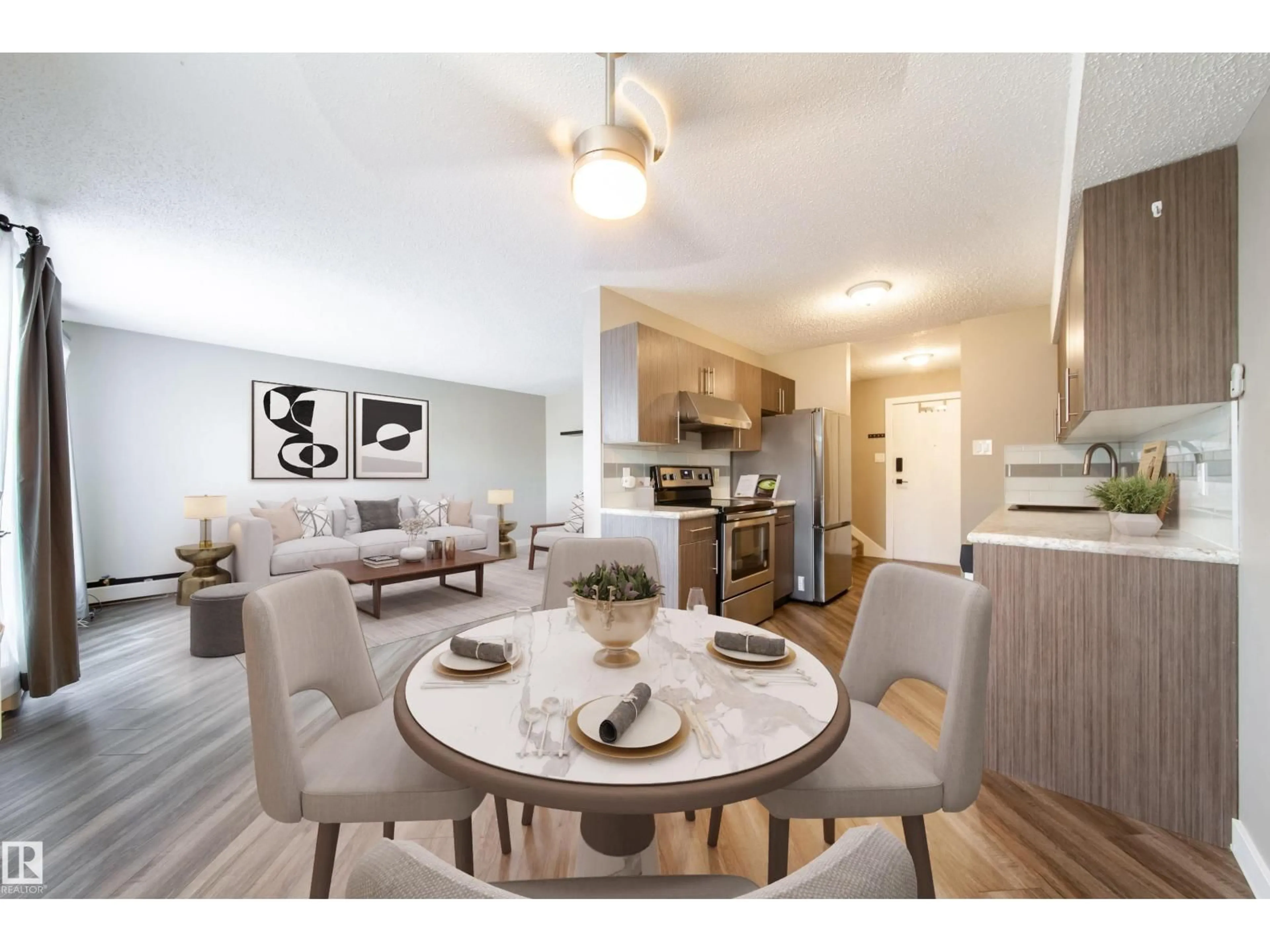 Open concept kitchen, wood/laminate floor for #117 - 6103 35A AV, Edmonton Alberta T6L1G7