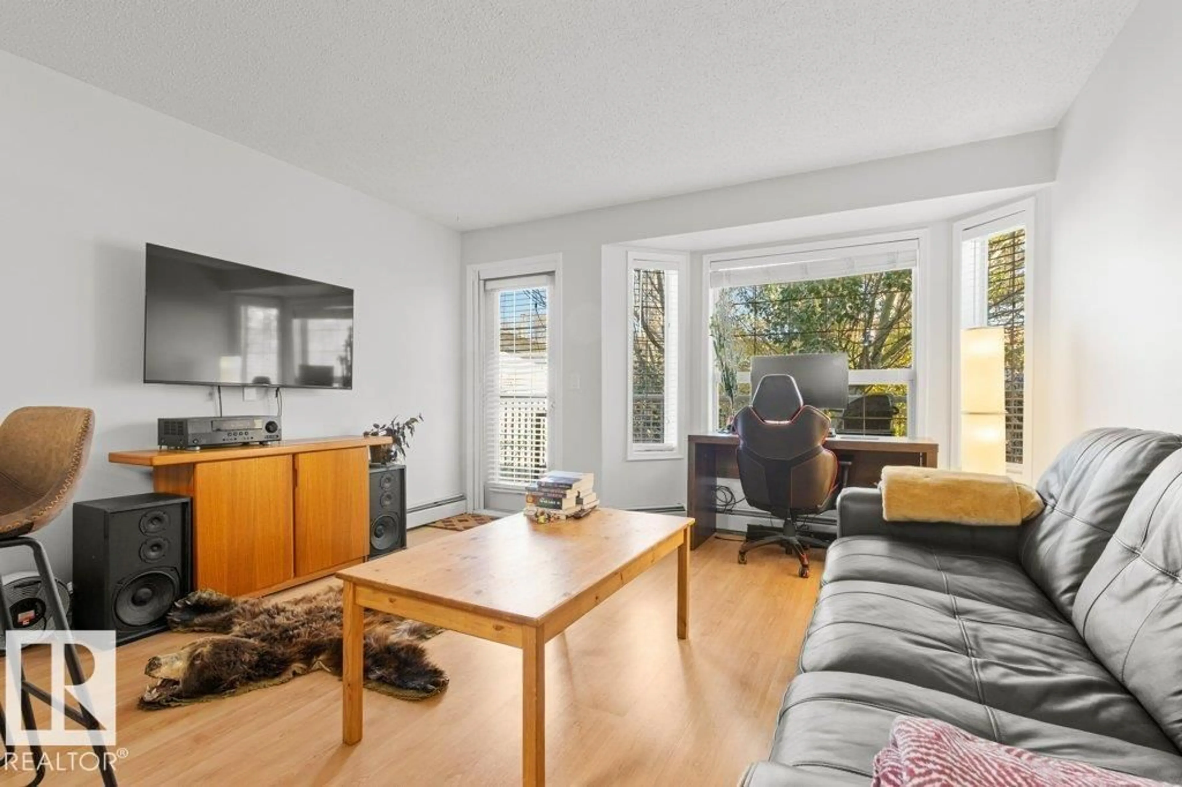 Living room with furniture, wood/laminate floor for #201 - 201 ALPINE BV, St. Albert Alberta T8N3Y3