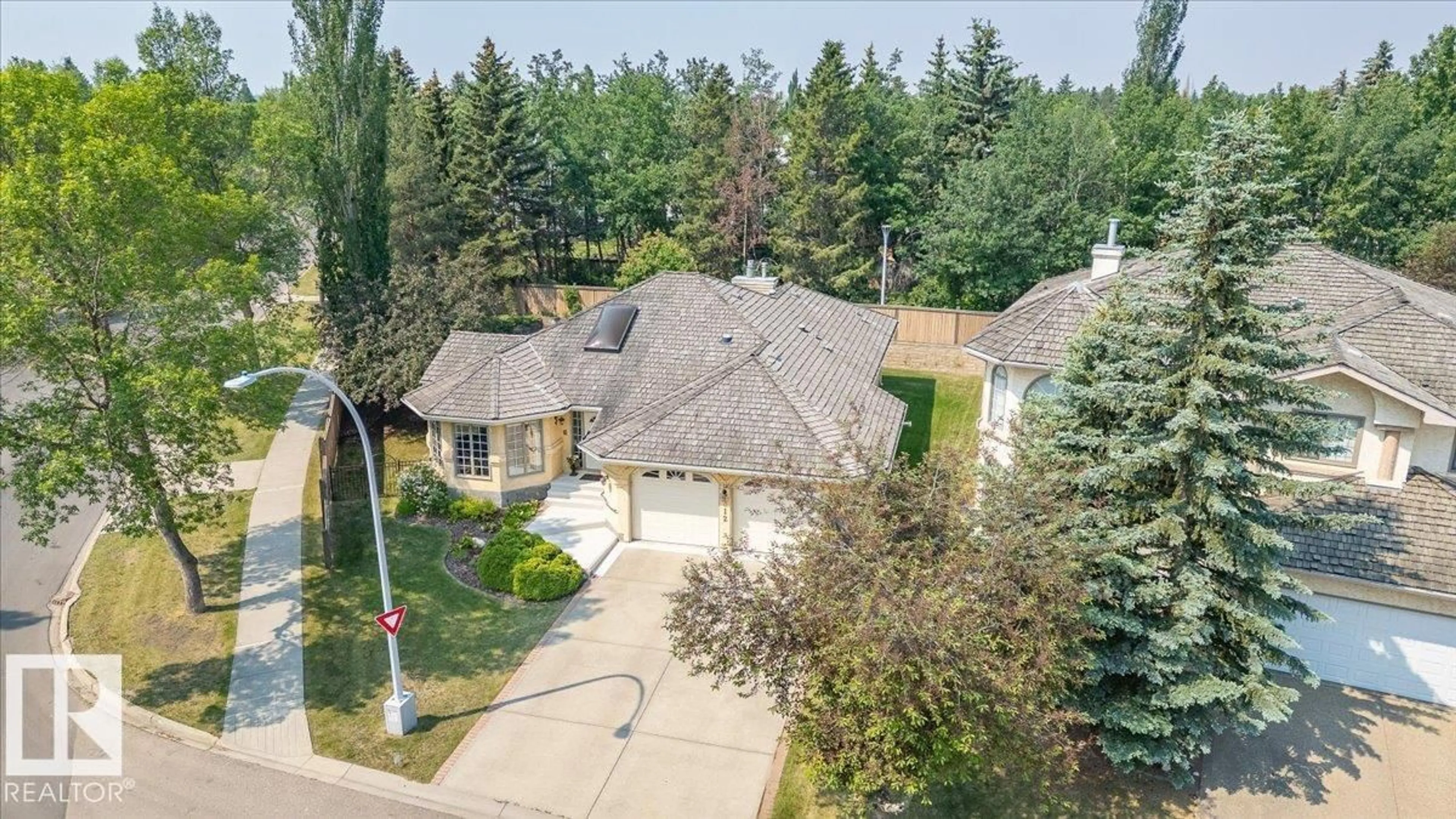 A pic from outside/outdoor area/front of a property/back of a property/a pic from drone, street for 312 BURTON RD, Edmonton Alberta T6R2G7