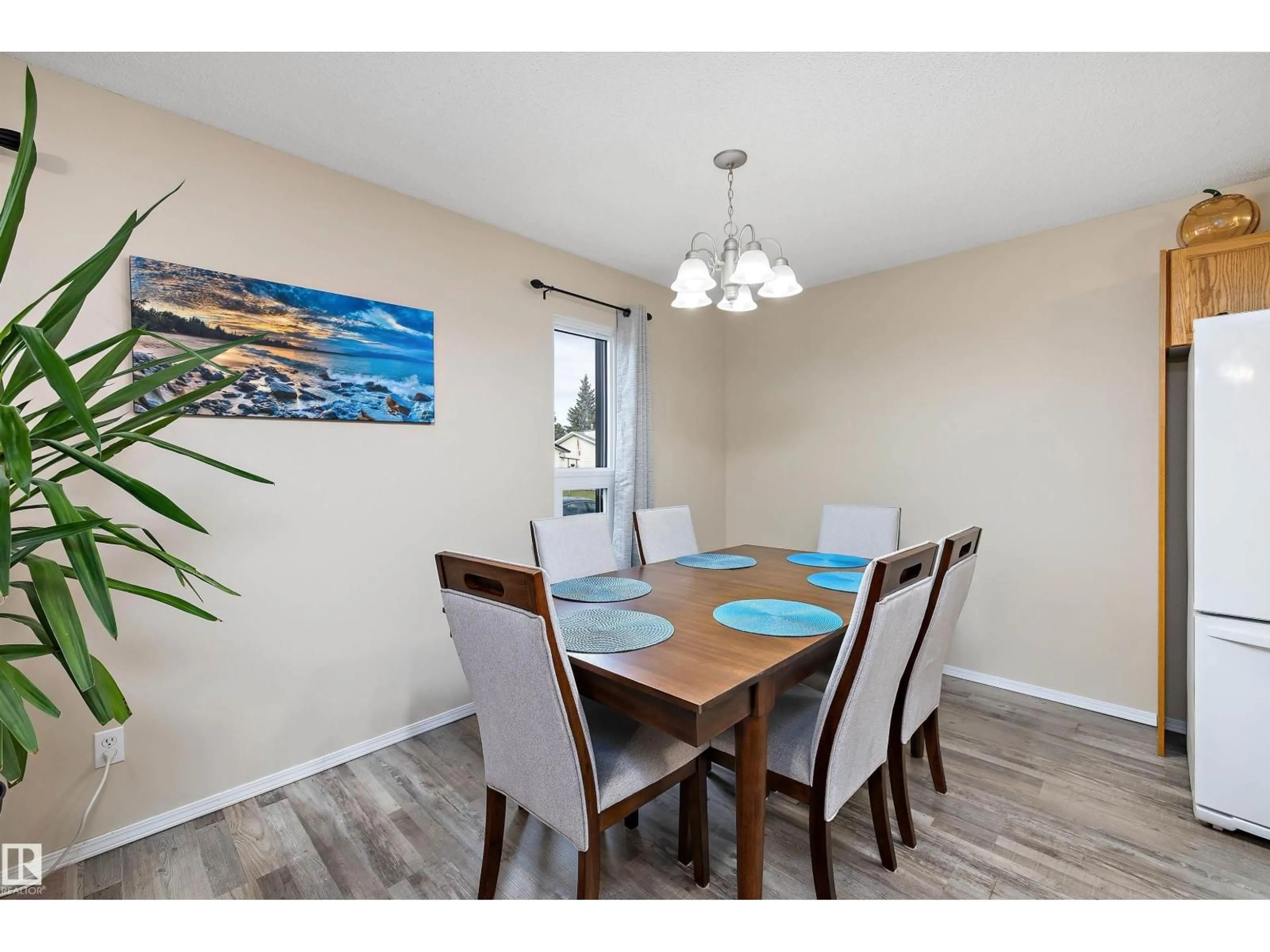 Dining room, wood/laminate floor for 113 ELM CR, Wetaskiwin Alberta T9A2C7