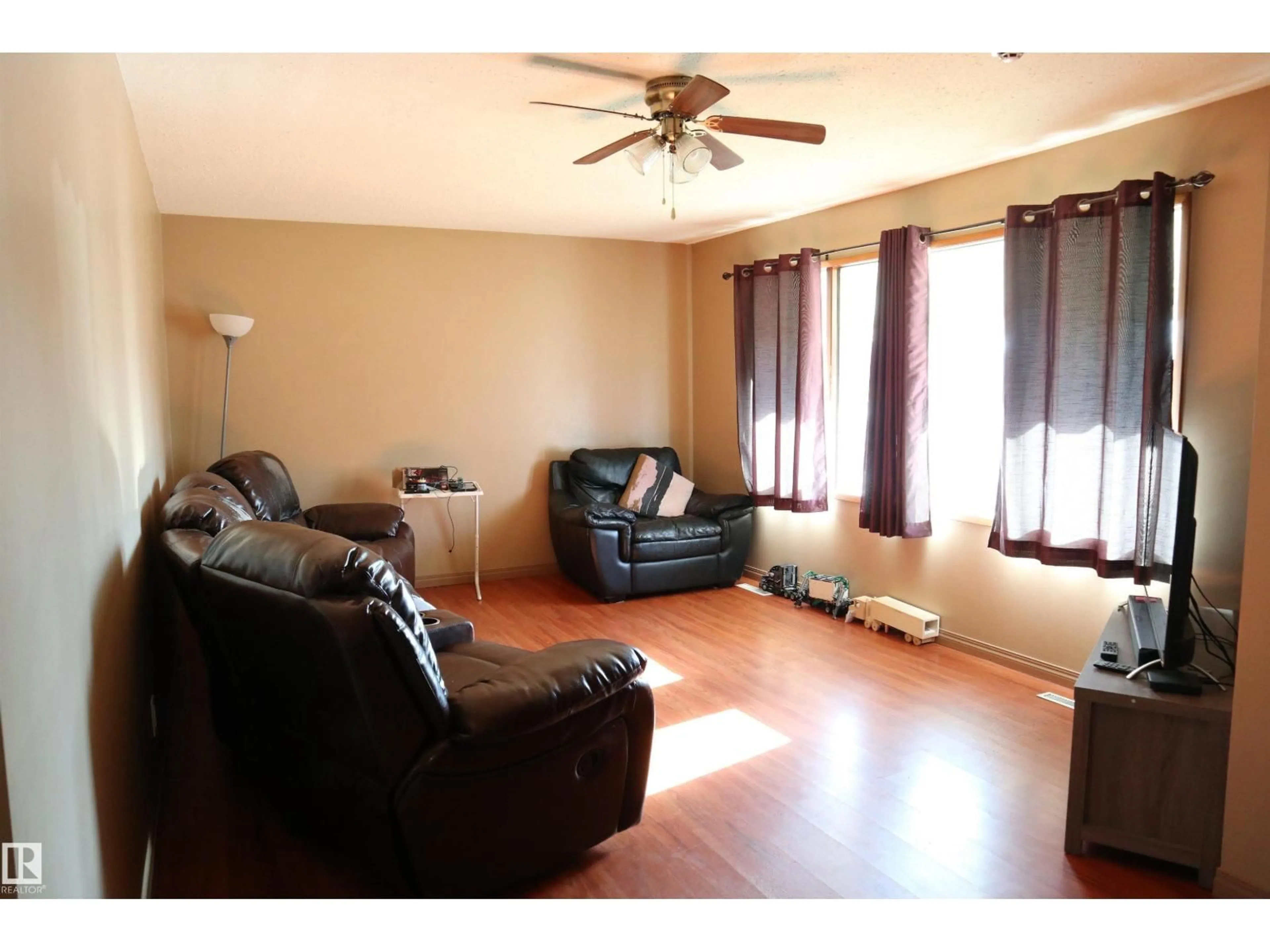 Living room with furniture, wood/laminate floor for 5010 40 AV, Wetaskiwin Alberta T9A0A3