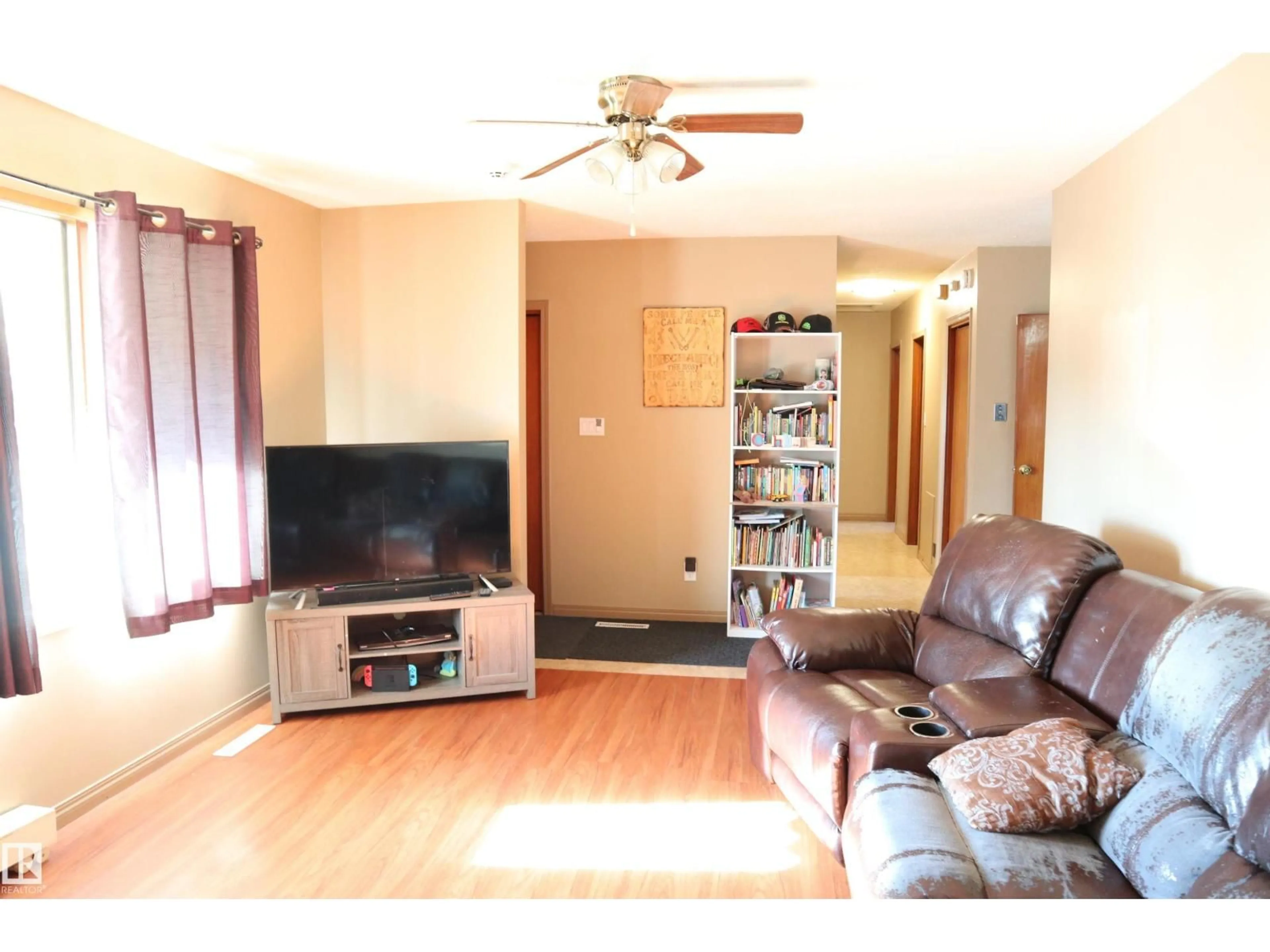Living room with furniture, wood/laminate floor for 5010 40 AV, Wetaskiwin Alberta T9A0A3